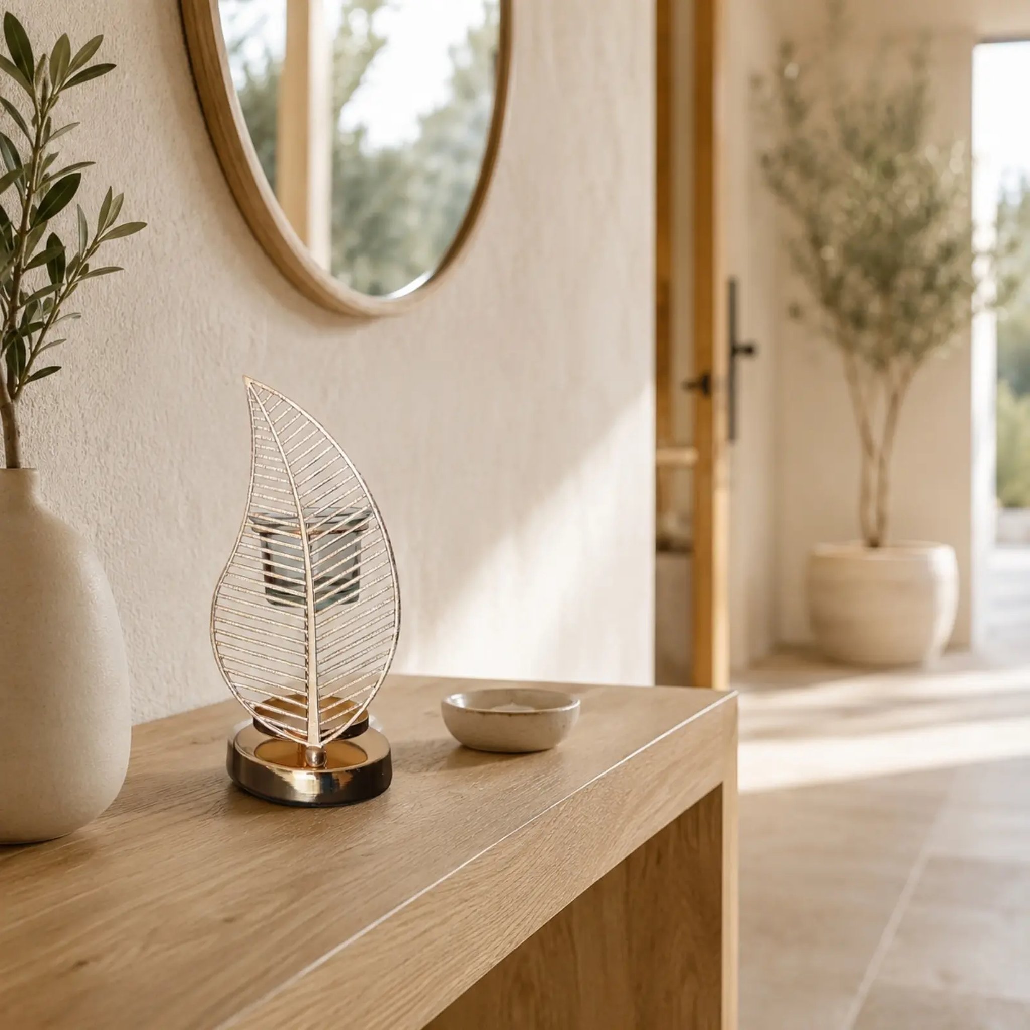 Palm leaf oil burner on a wooden console in a bright entrance