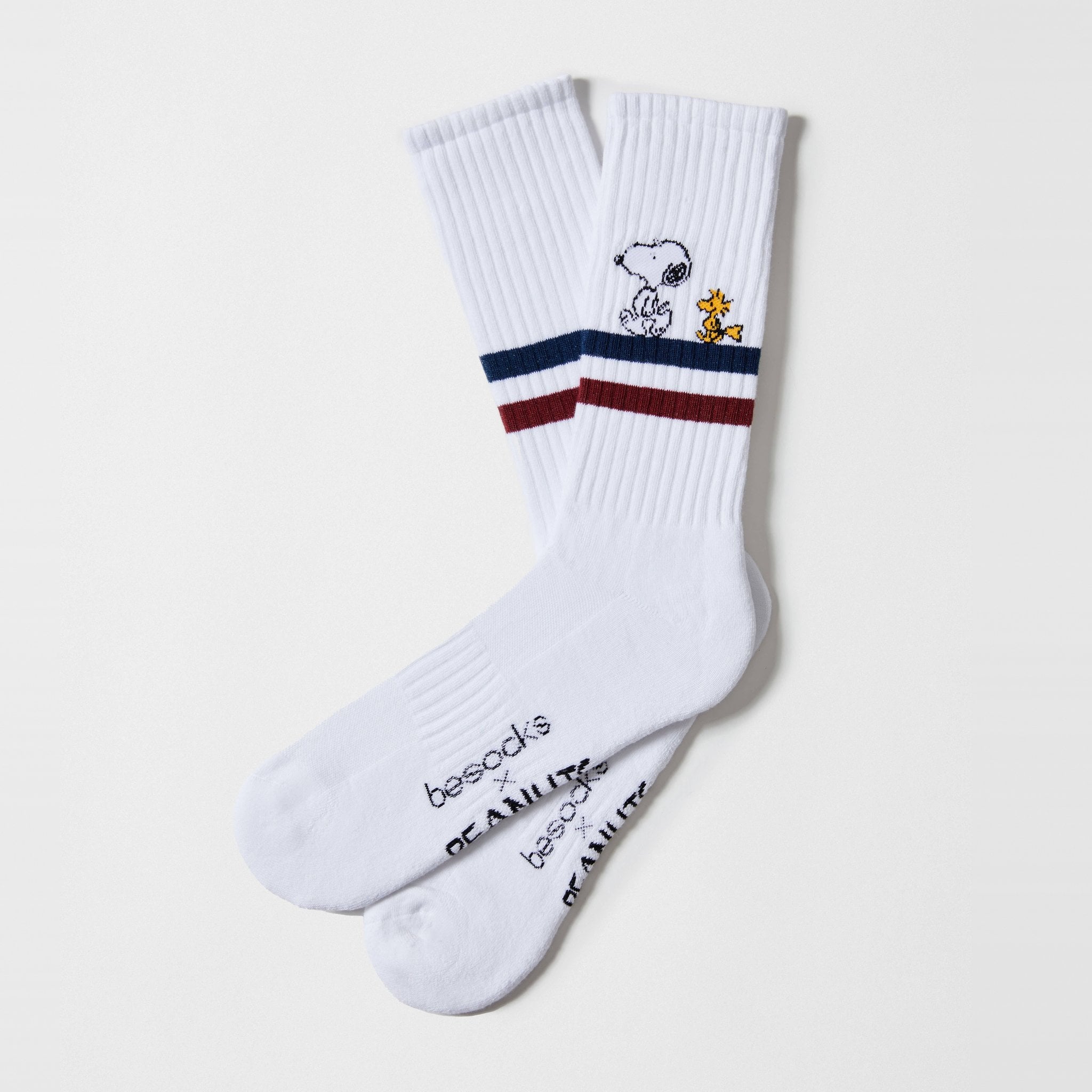 White tennis socks with navy and burgundy stripes and Snoopy with Woodstock from the Street socks set