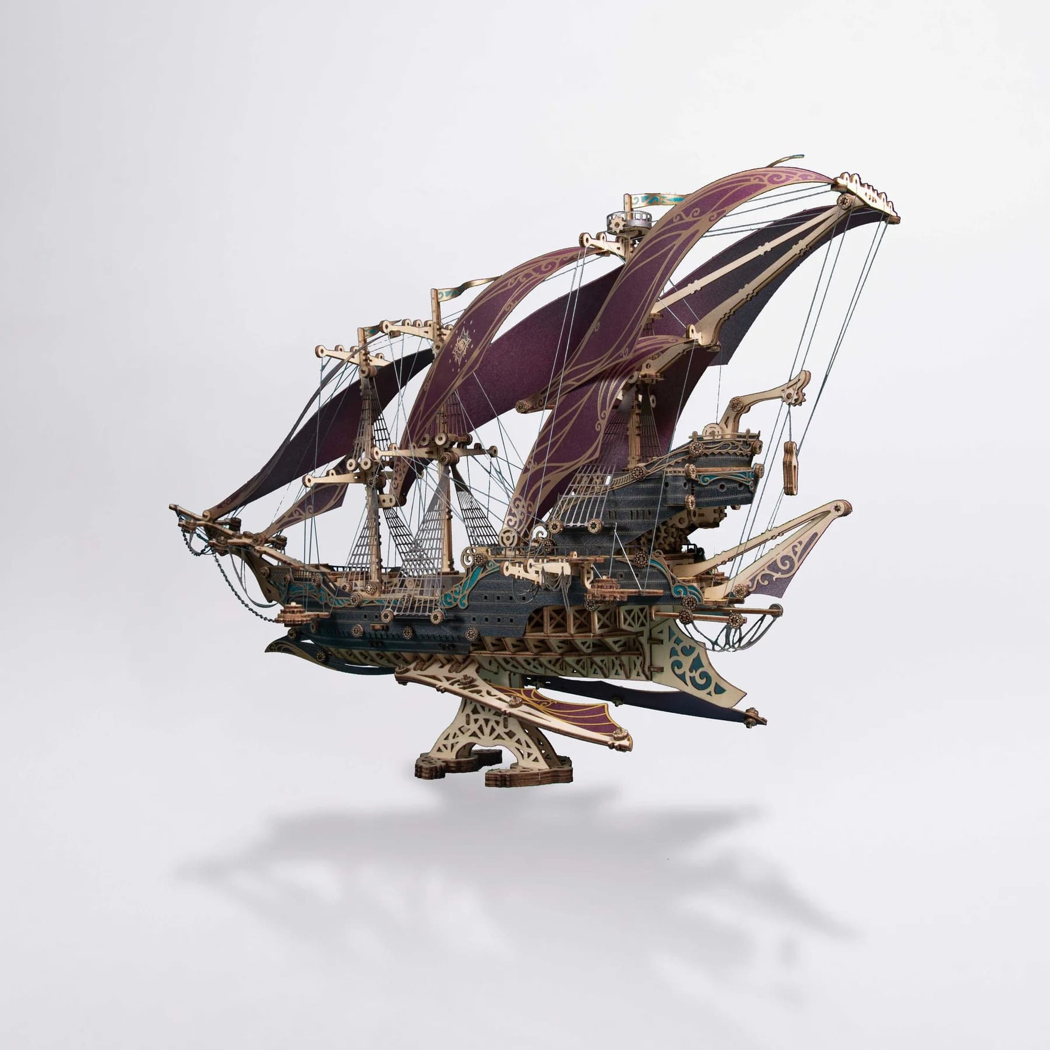 Finished fantasy sailing ship seen from the front at an angle on a light background