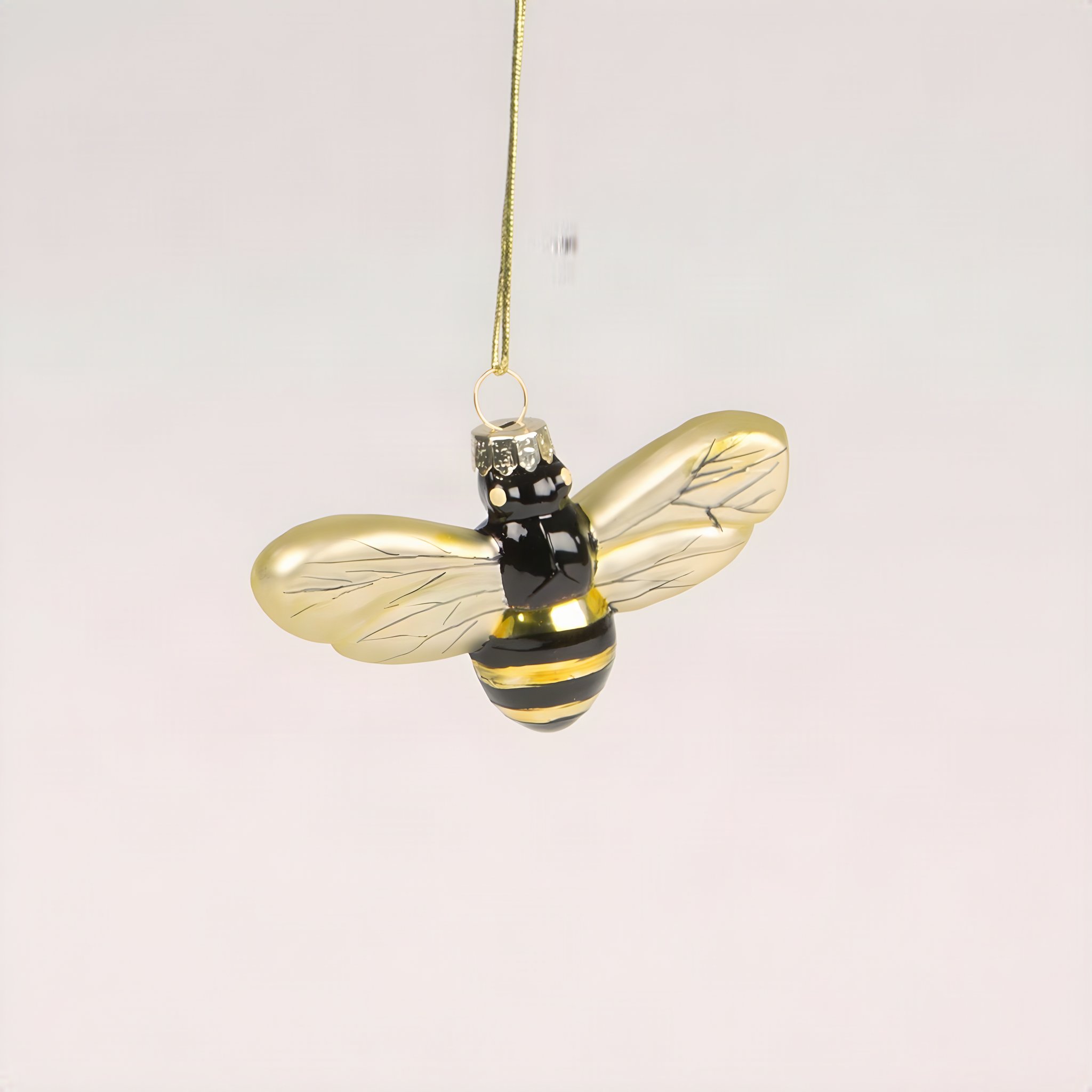 Bee tree decoration with golden wings and a black and yellow body