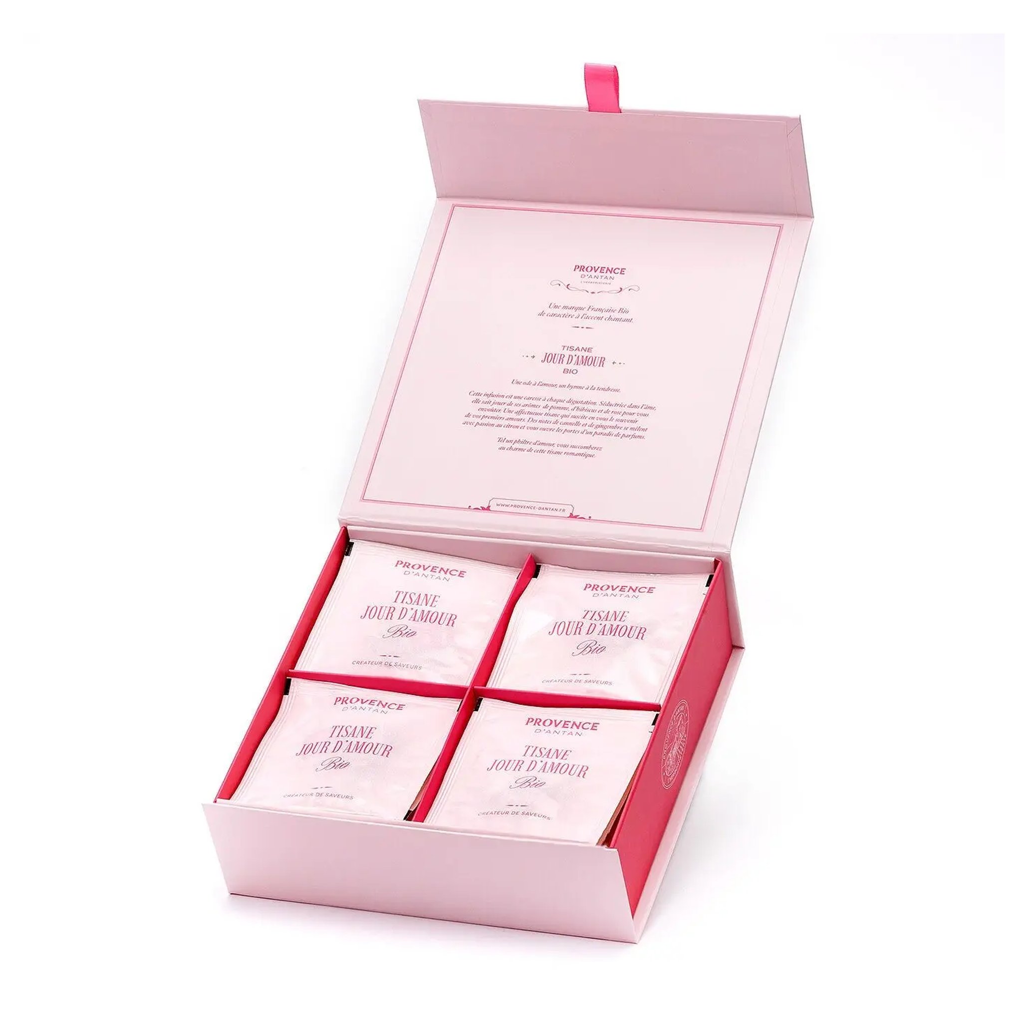 Opened Jour d'Amour box with text inside the lid and individually wrapped tea bags