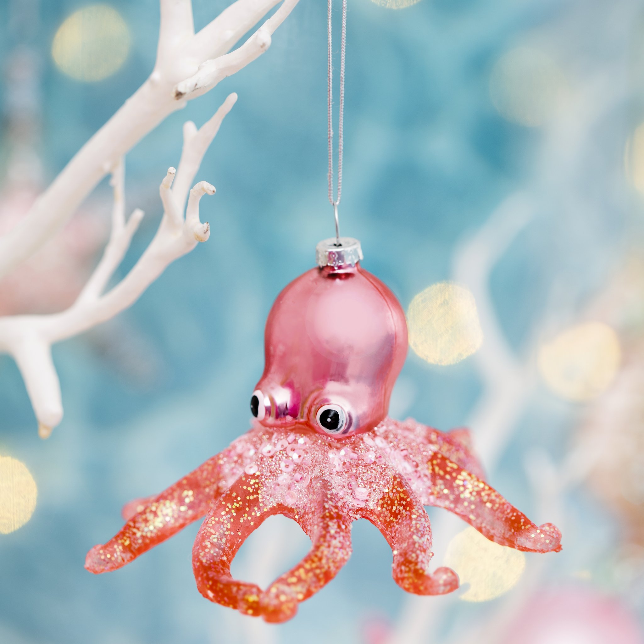 Sass & Belle octopus glitter bauble in a maritime underwater-themed setting with light reflections – lifestyle shot