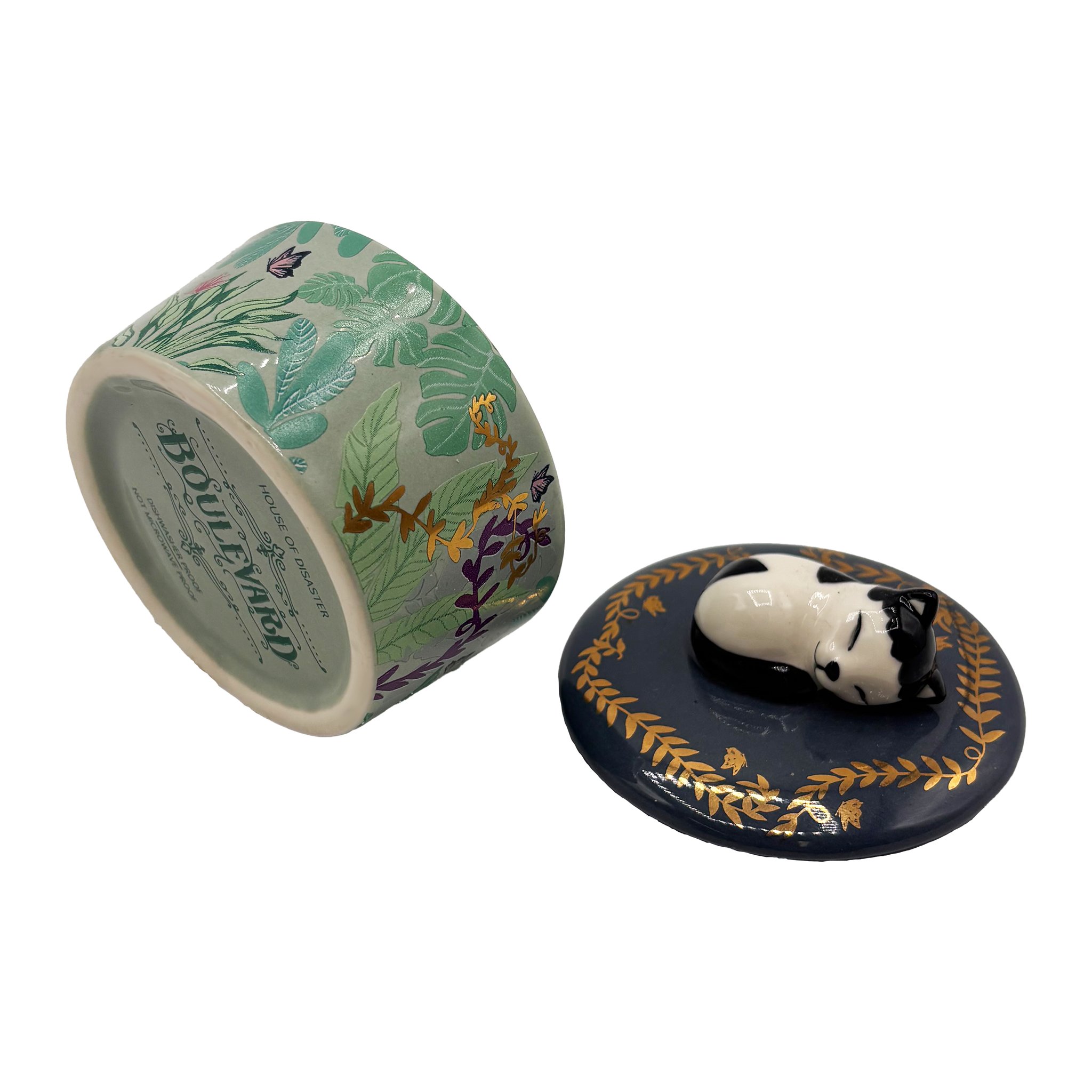Cat trinket pot opened at an angle from above, Boulevard stamp on the base visible, lid beside it