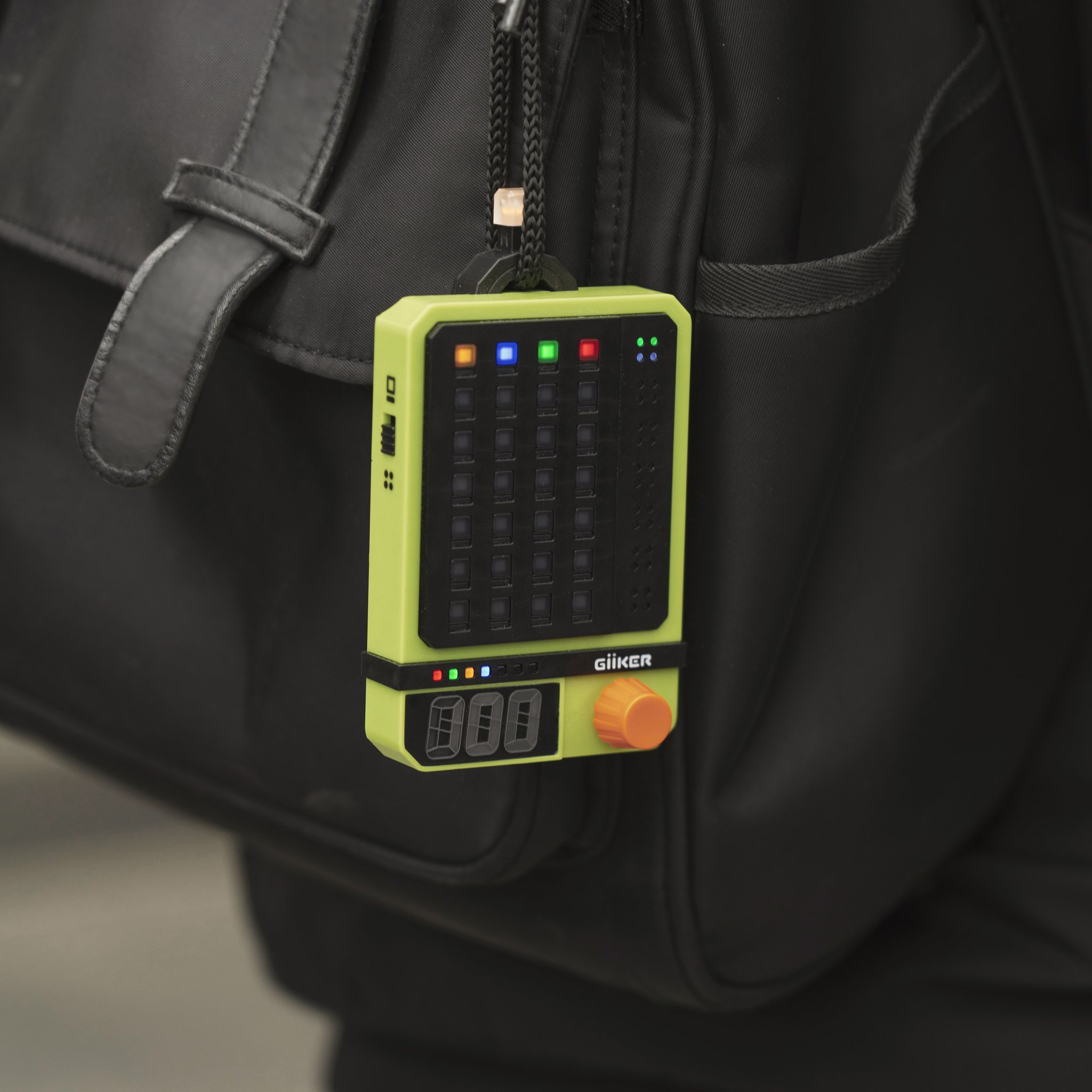 The Super Decoder clipped to a backpack, the code-breaking game for on the go.