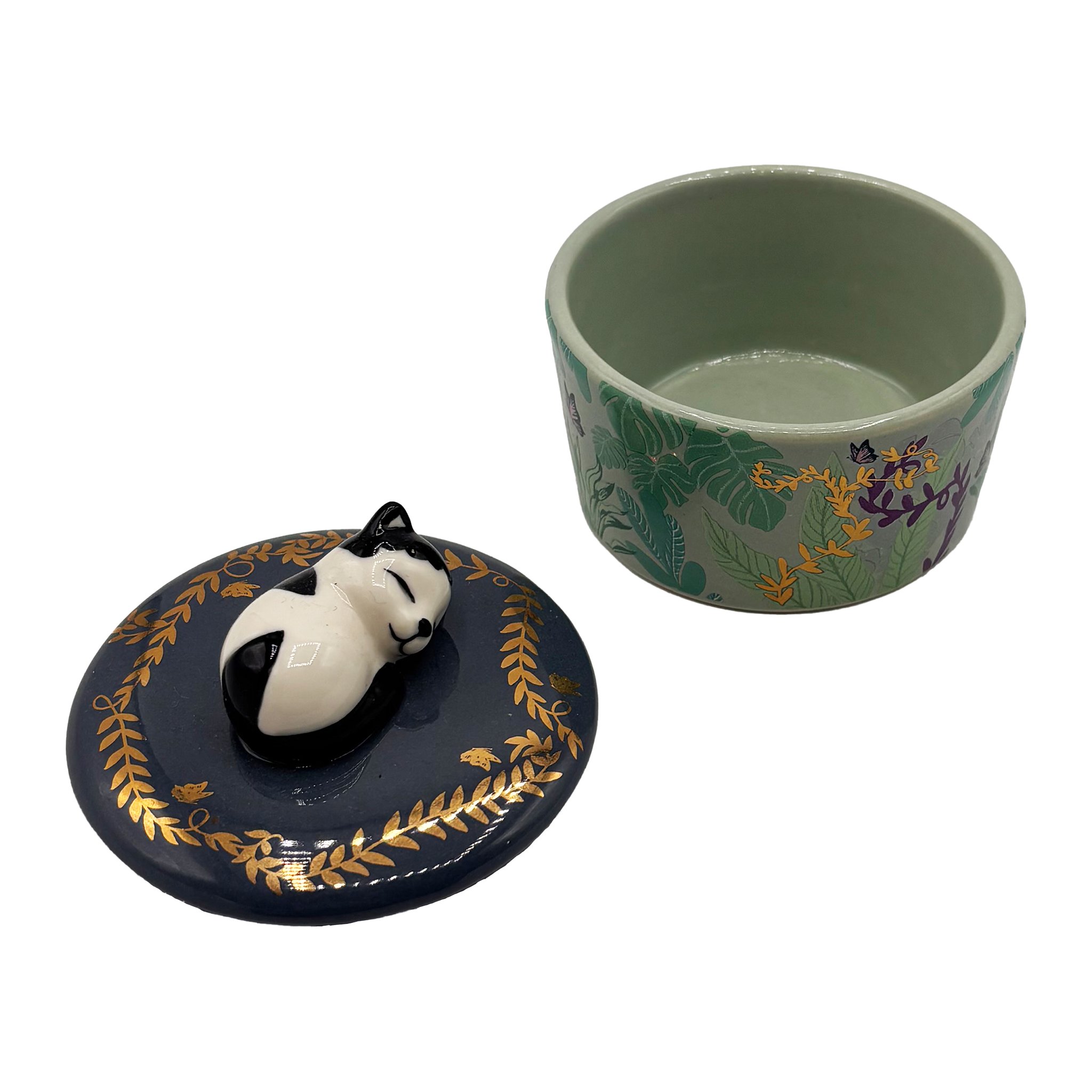 The cat trinket pot opened, lid with cat beside it, light green glaze inside