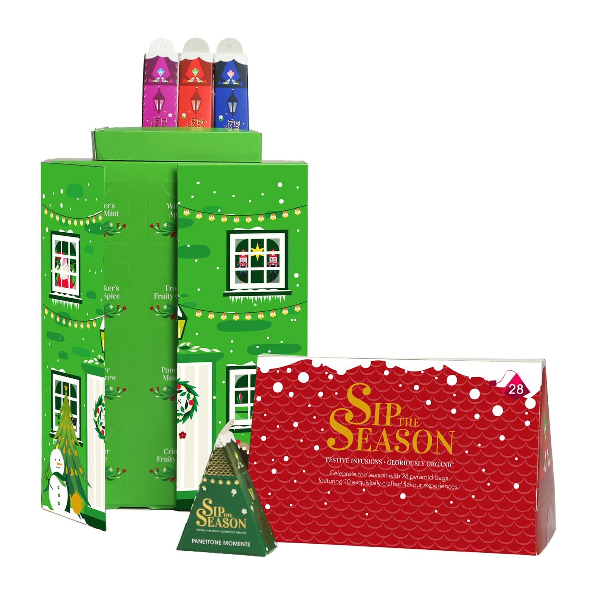 Coffret de thé déballé avec compartiments, toit posé à côté et pyramide Panettone Moments