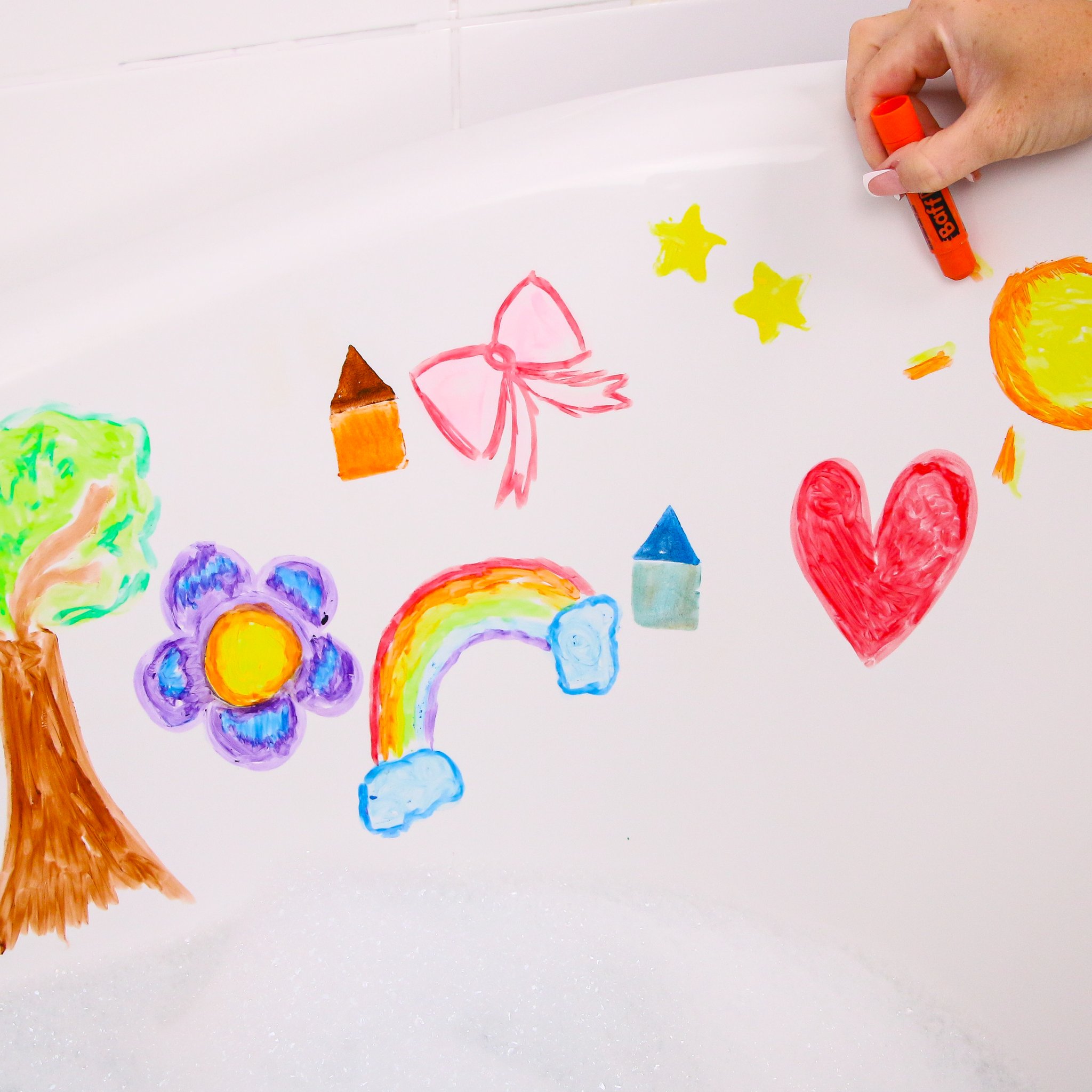 Tree, flower and rainbow painted on the bathtub