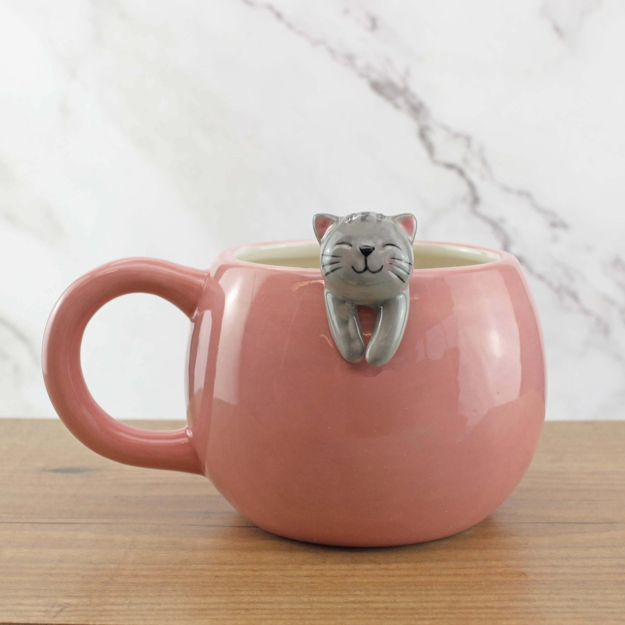 Lazy Cat Mug ceramic on wooden table with marble background