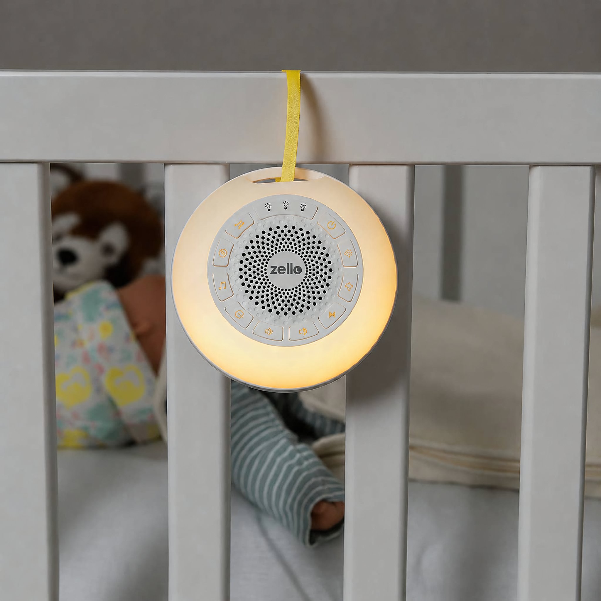 White Noise Maschine mit Nachtlicht am Babybett