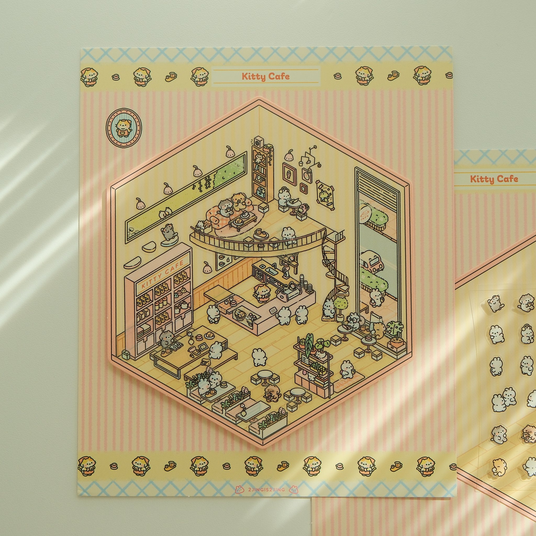 The finished kitty cafe scene: curved counter, display cabinets and cat characters