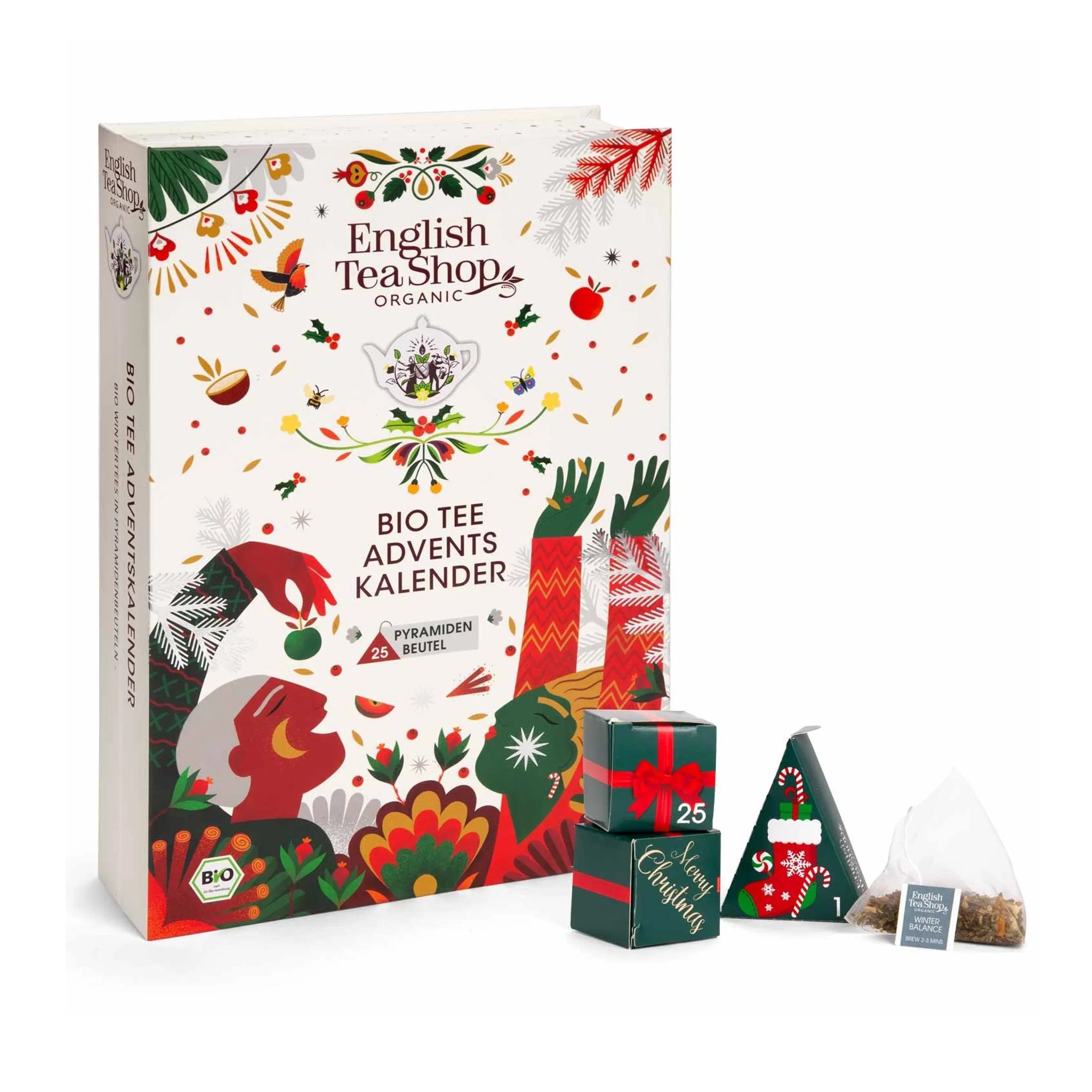 Closed book-style tea advent calendar with tea boxes and a pyramid tea bag in front