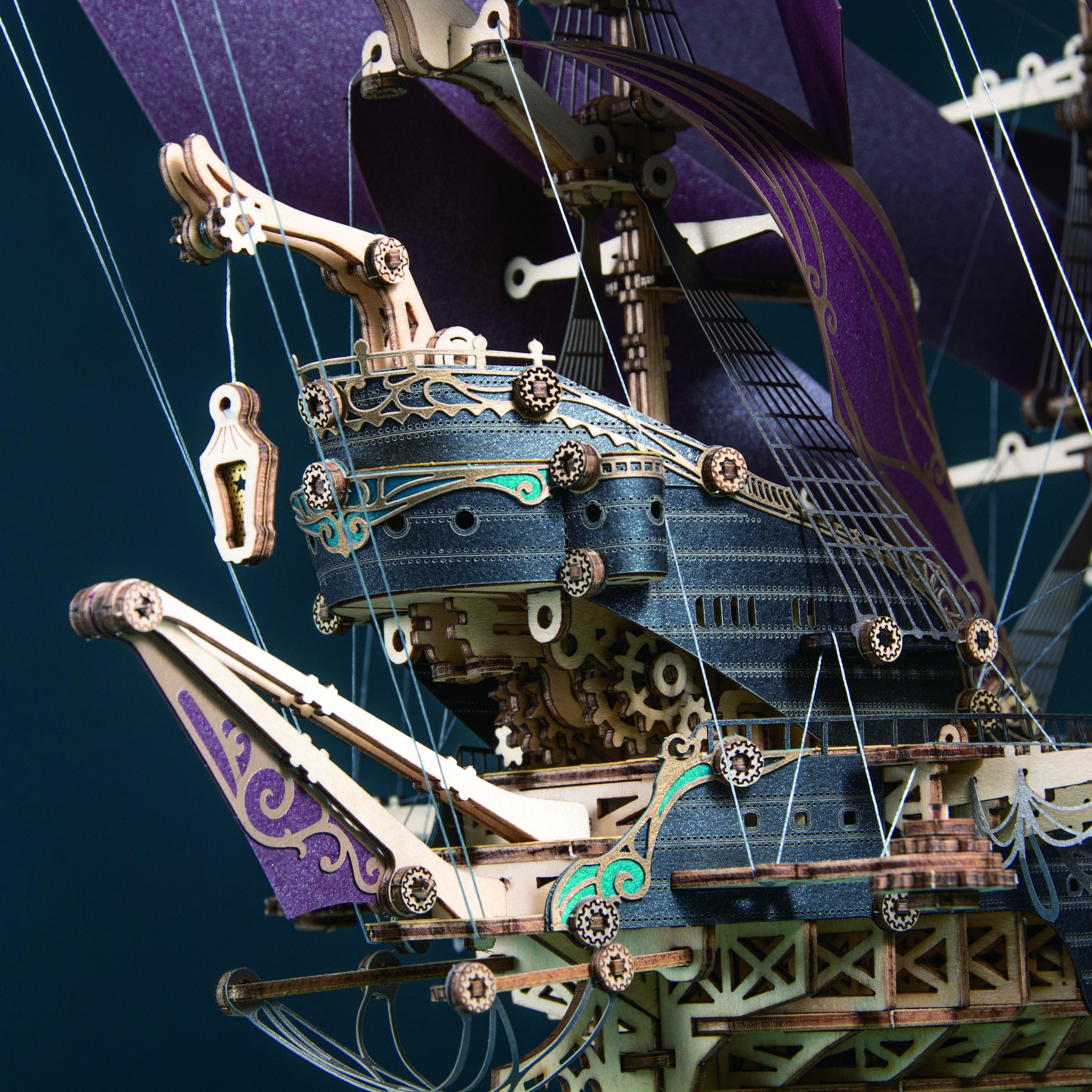 Detail of the rigging with crane, gears and ornamented sails