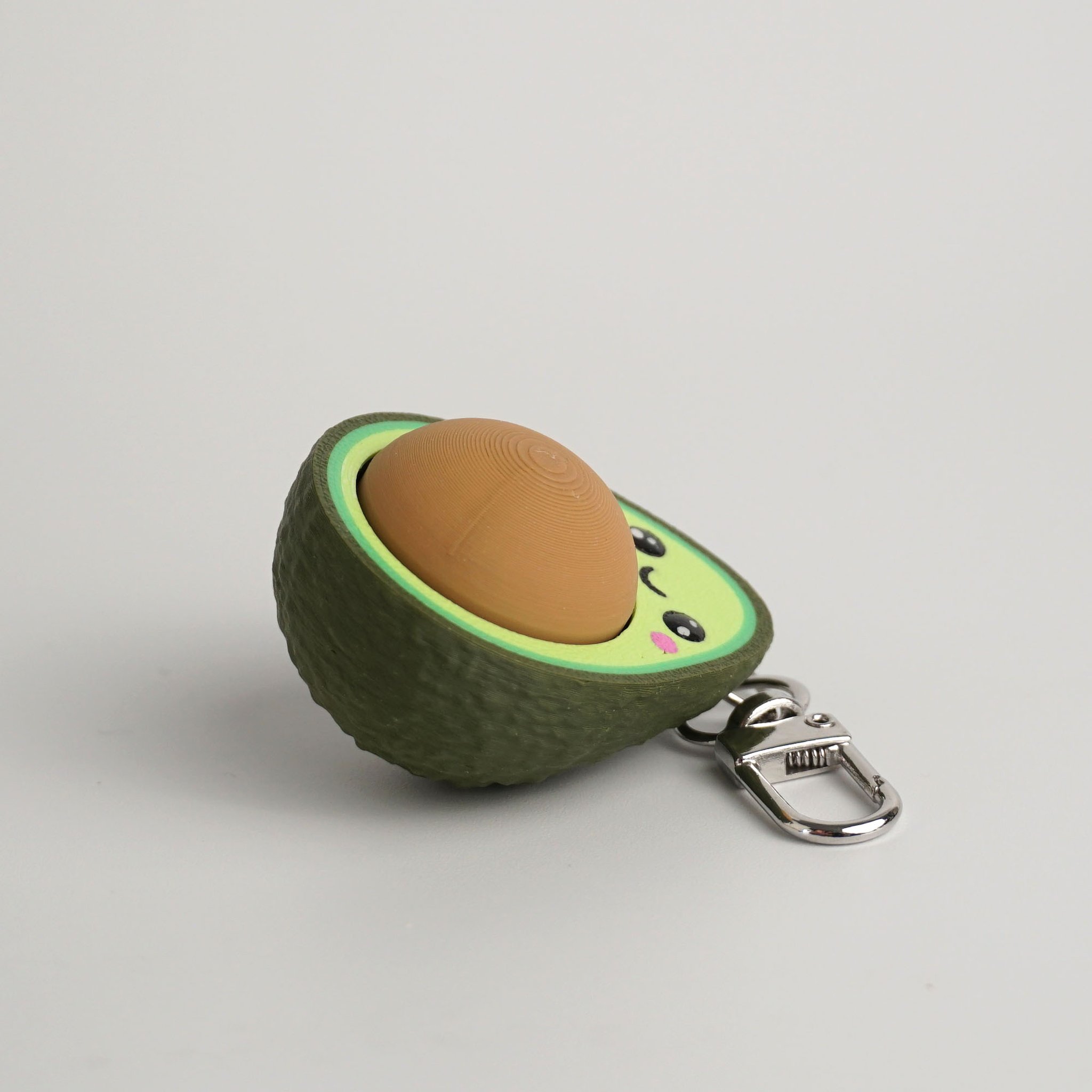 Tukitsu Avocado Clicker Schlüsselanhänger — Detail Klick-Mechanismus
