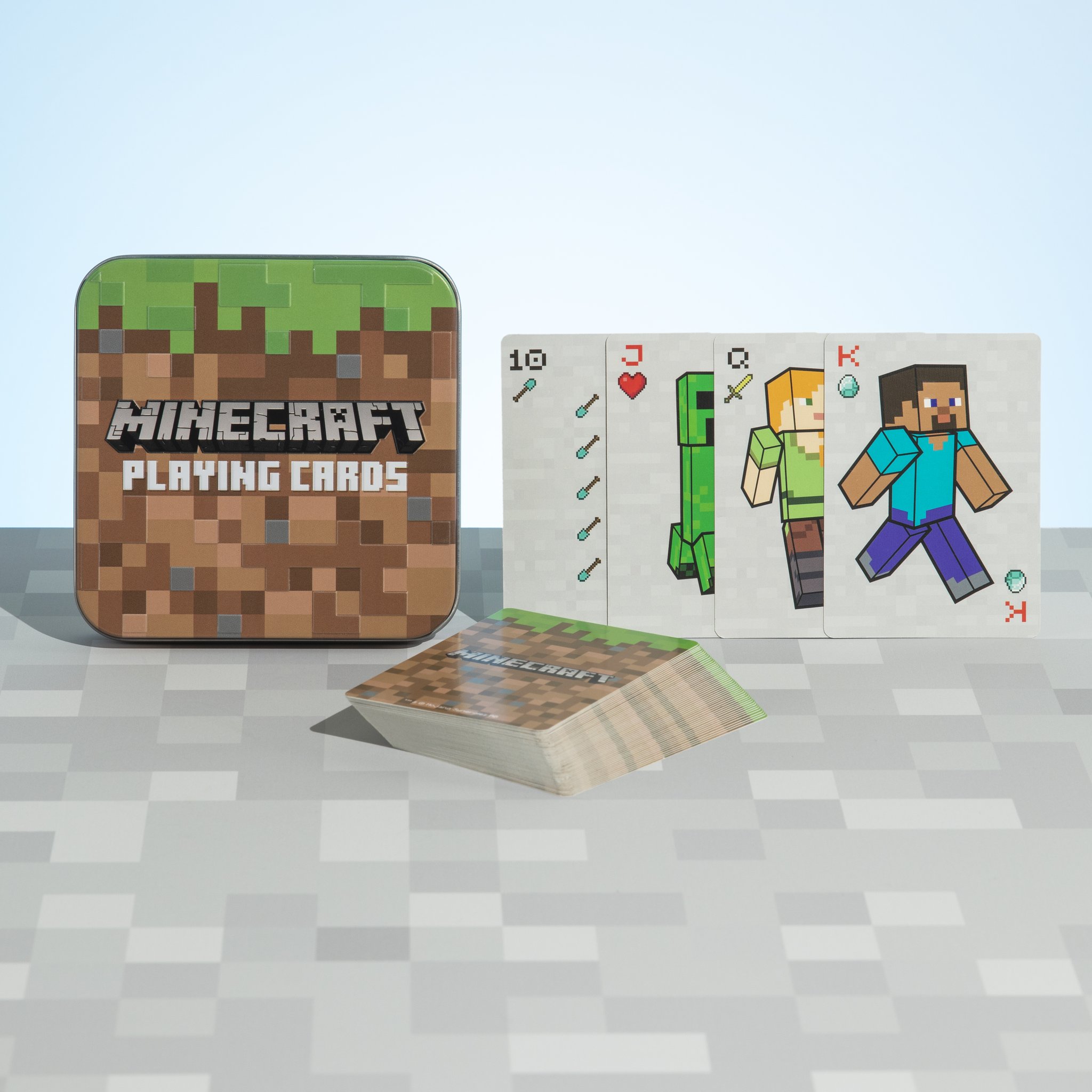 Blechdose mit aufgestellten Karten, darauf Minecraft-Figuren