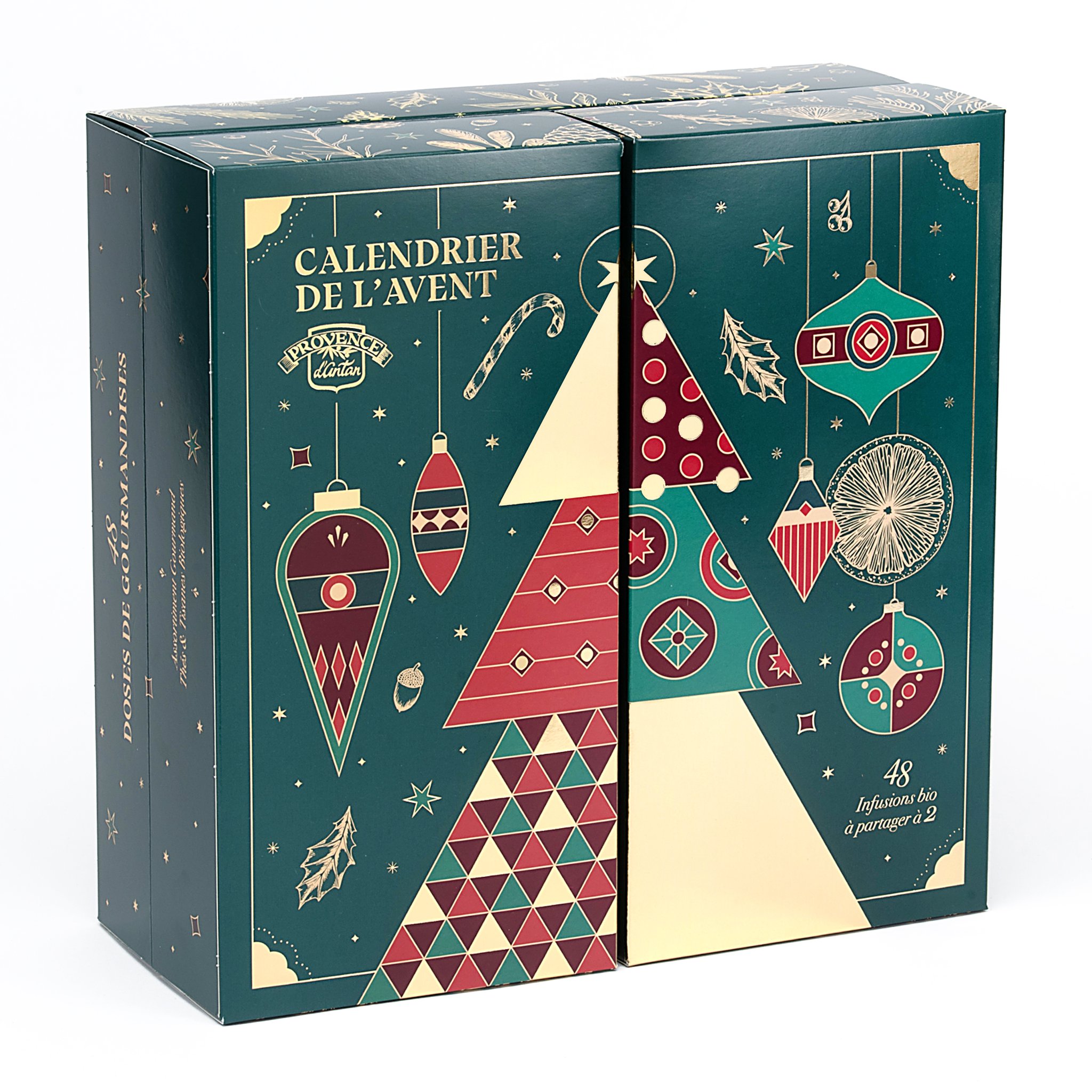 Le calendrier vert pétrole fermé, vu de biais, imprimé d'un sapin et de boules de Noël.