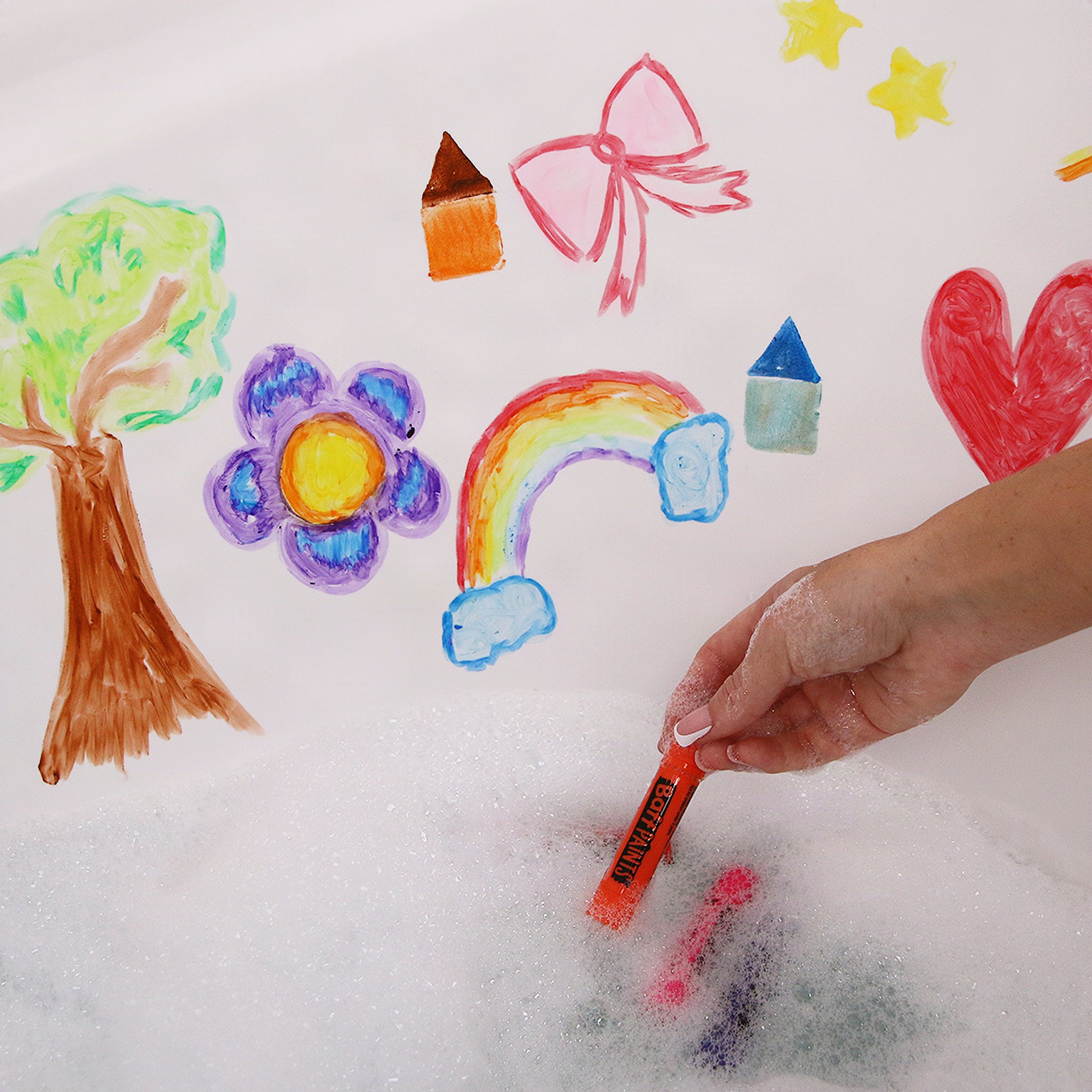 Child painting on the tub above the bath foam