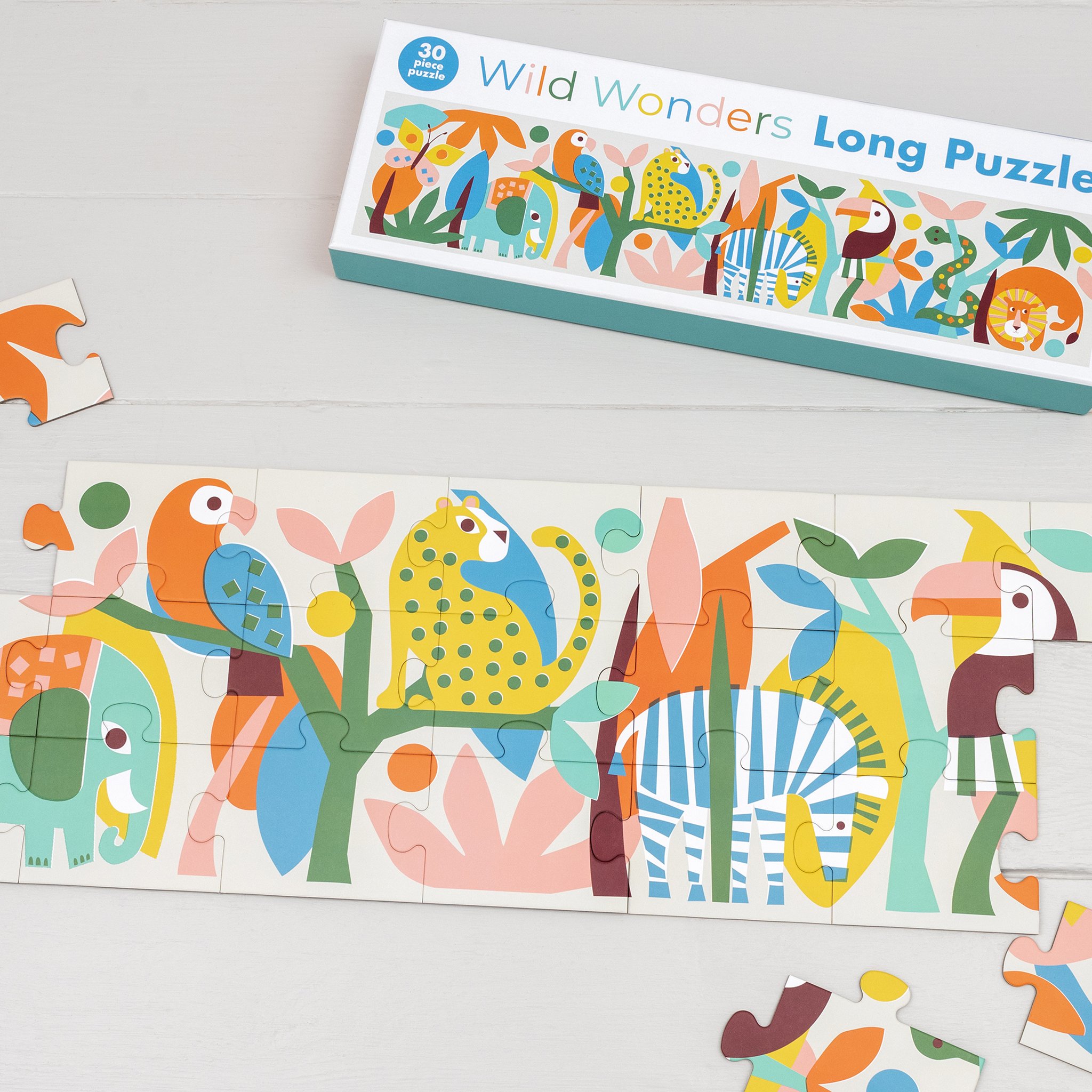 Wild Wonders animal puzzle partly assembled with parrot and zebra, box behind