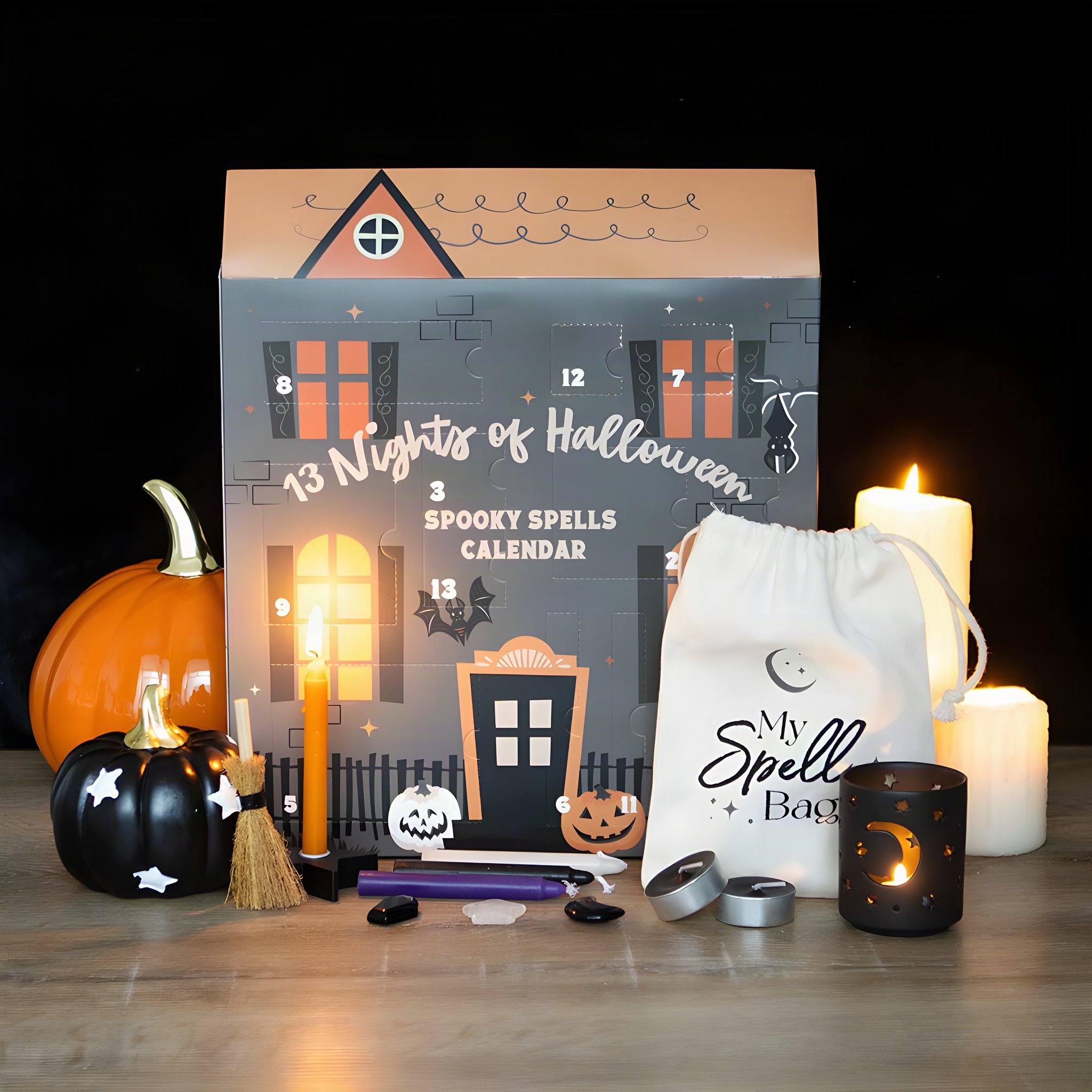 13 Nights of Halloween calendar with spell candles, cotton bag and pumpkin in a candlelit scene