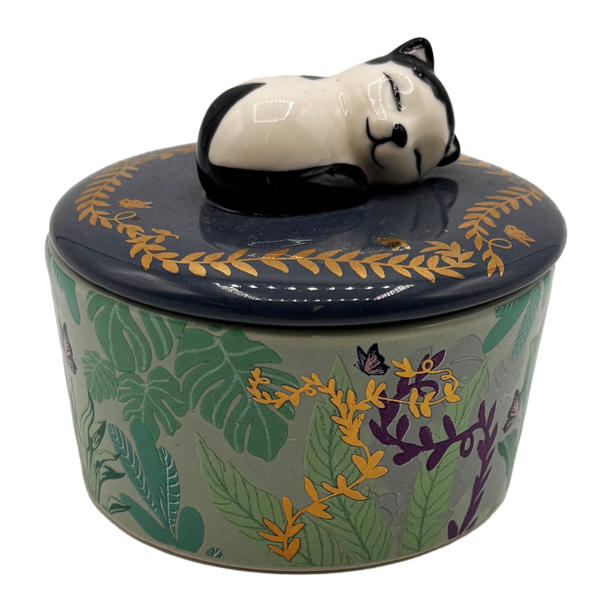 Boulevard cat trinket pot in porcelain, closed: sleeping black and white cat on the dark blue lid, green leaf pattern with gold accents