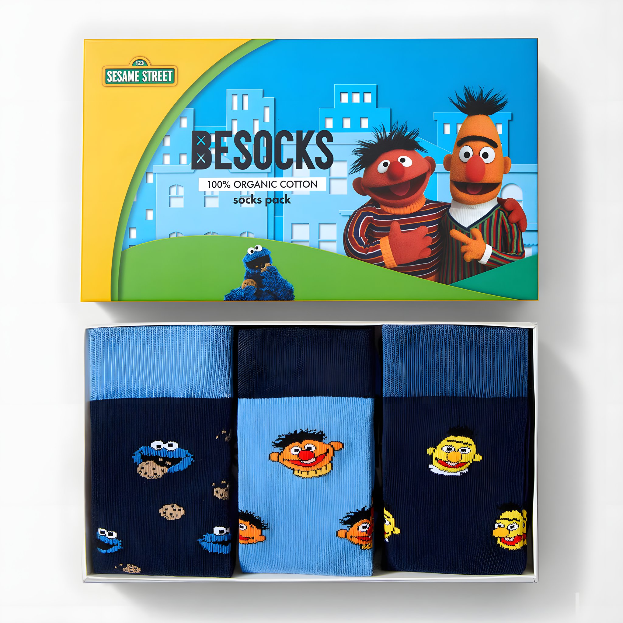 Open gift box of the Sesame Street socks set with three pairs of socks: Cookie Monster, Ernie and Bert