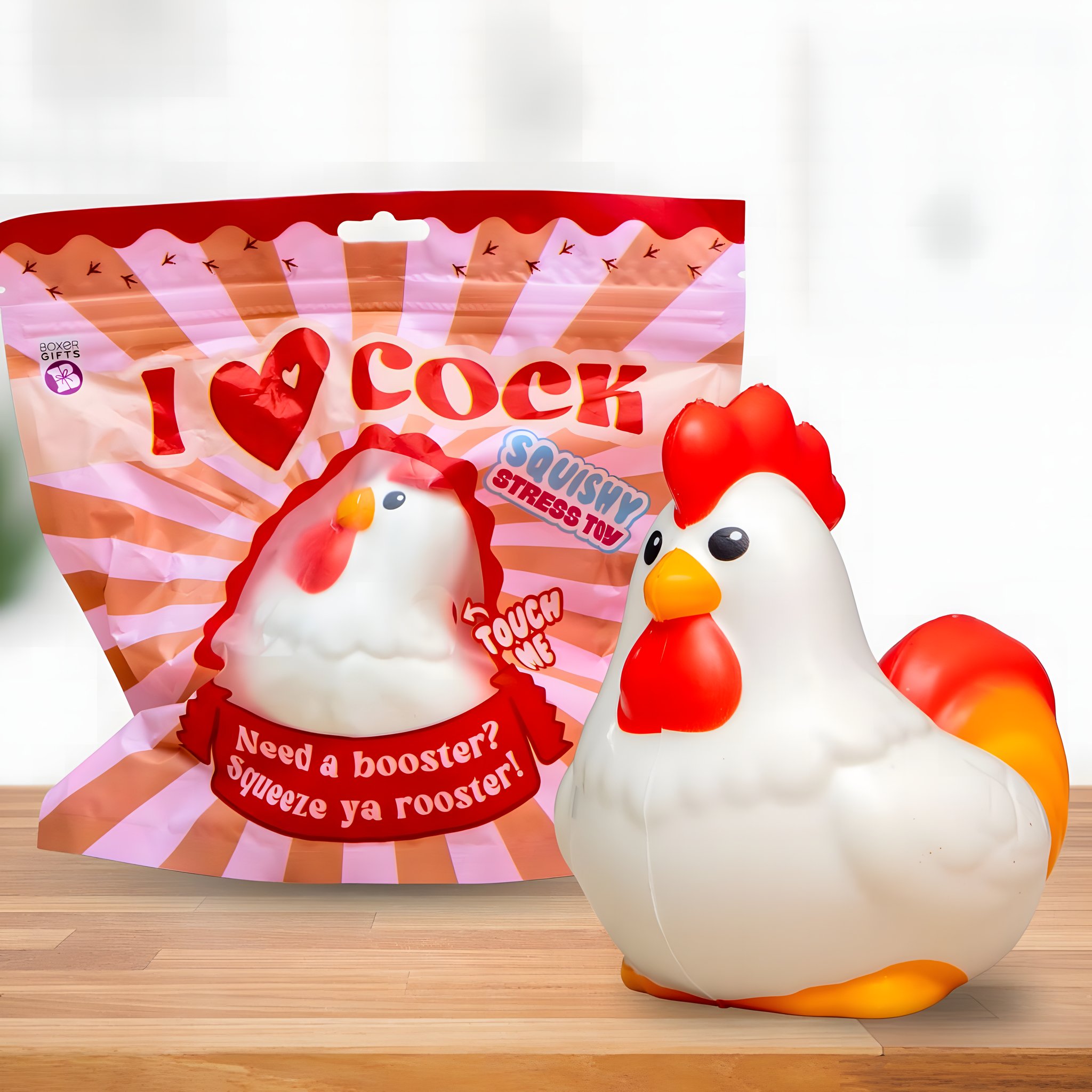 Squishy gallo bianco e rosso I Love Cock accanto alla bustina stampata