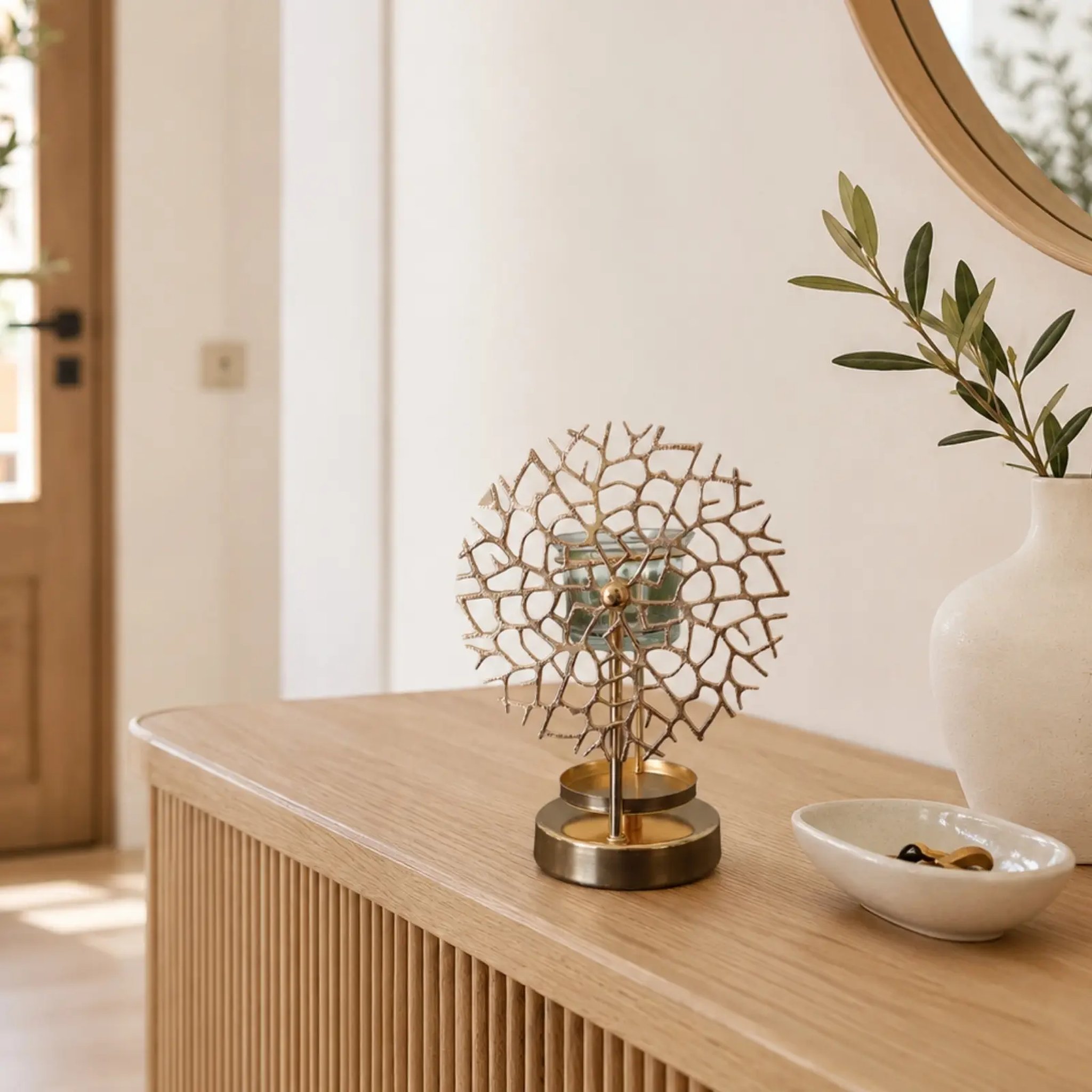 Coral pattern oil burner on a wooden chest in a bright hallway