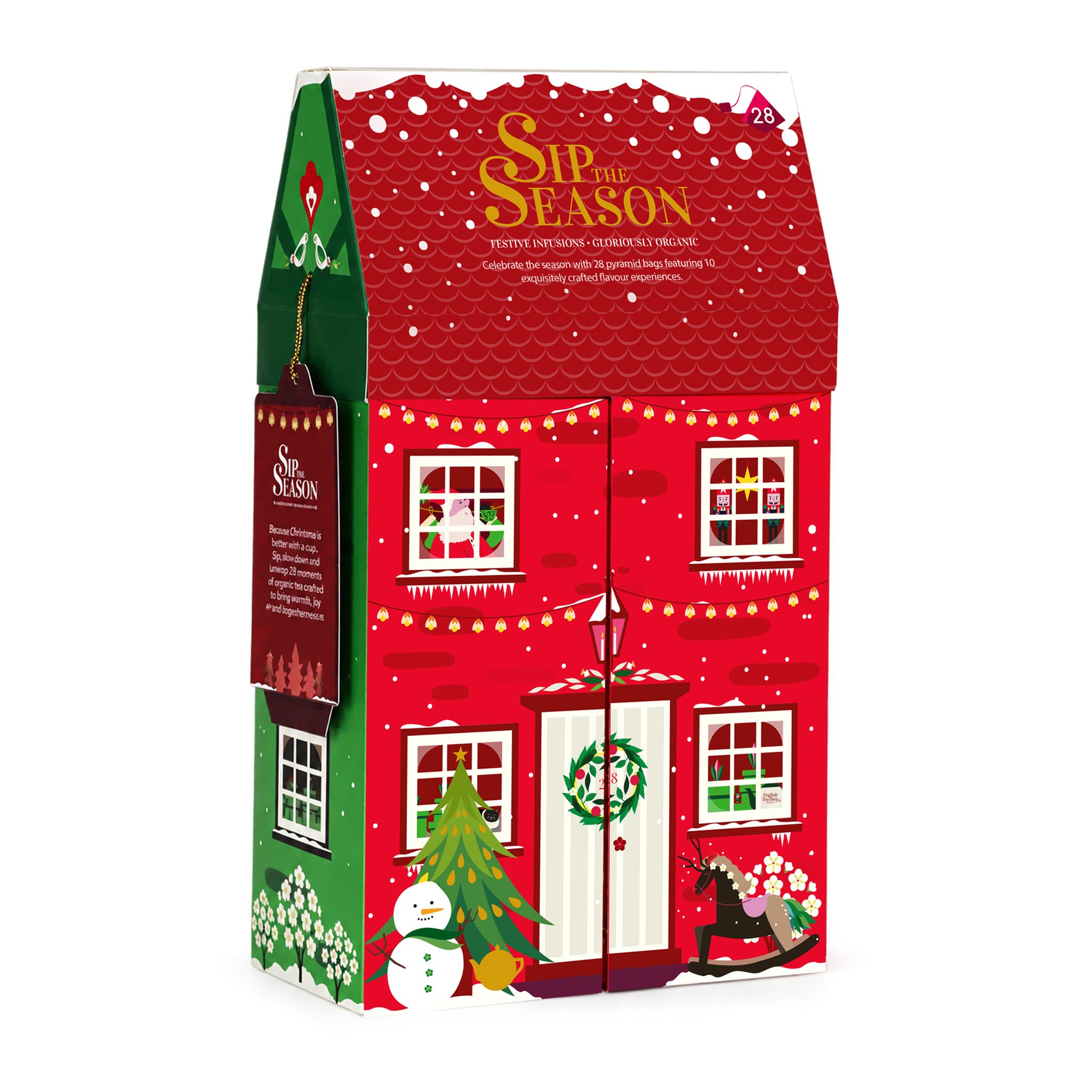 Tee-Geschenkset Winterhaus: rotes Haus mit grüner Seitenwand, Schneemann, Tannenbaum und Anhänger