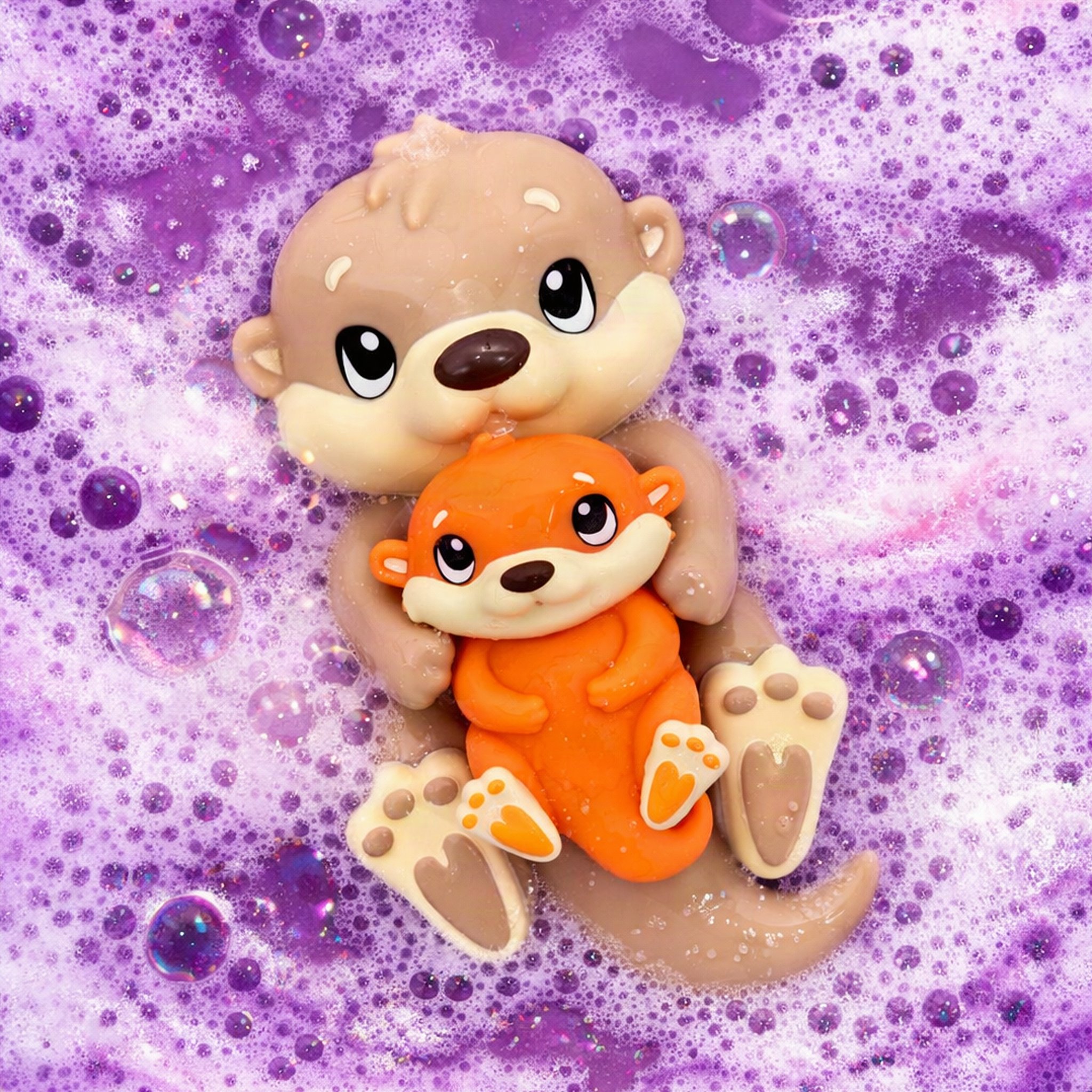 Mother and baby otter floating in the purple foam of the lavender bath bomb