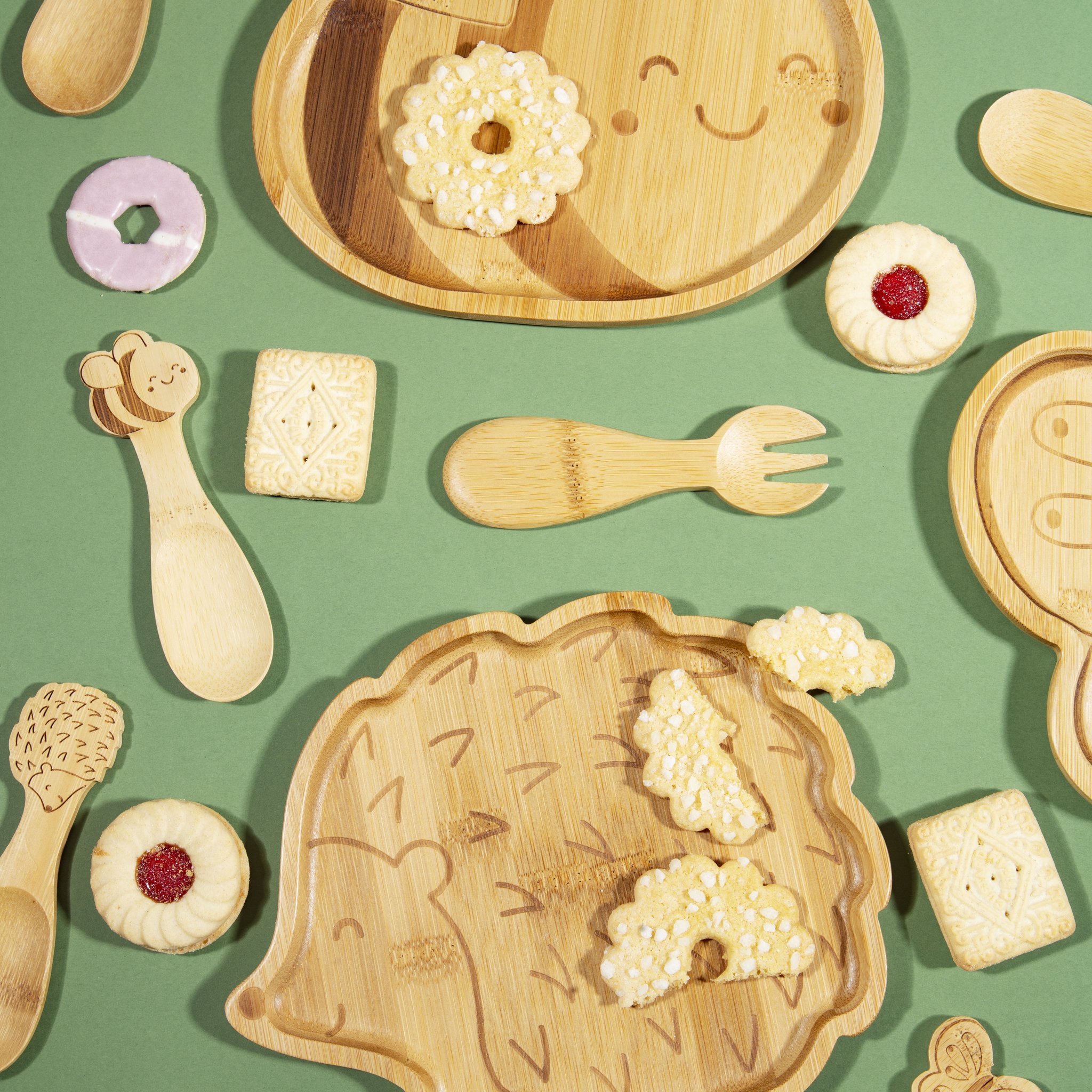 Hedgehog kids plate with pastries and cutlery, top view