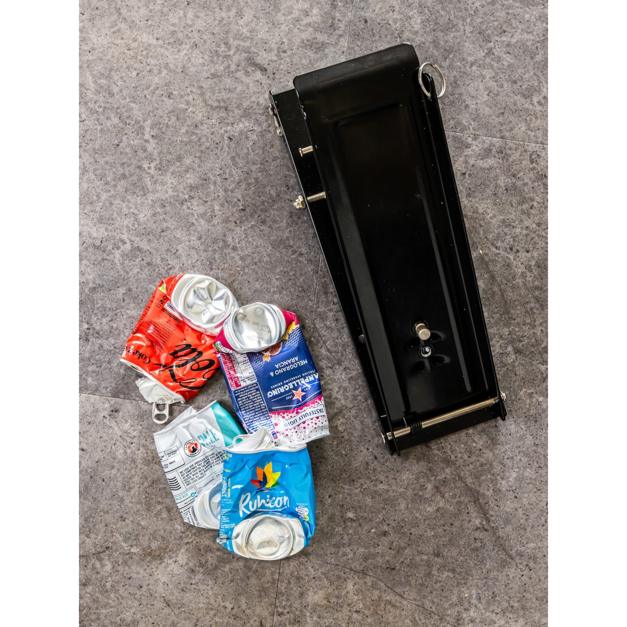 Can crusher top view with crushed cans