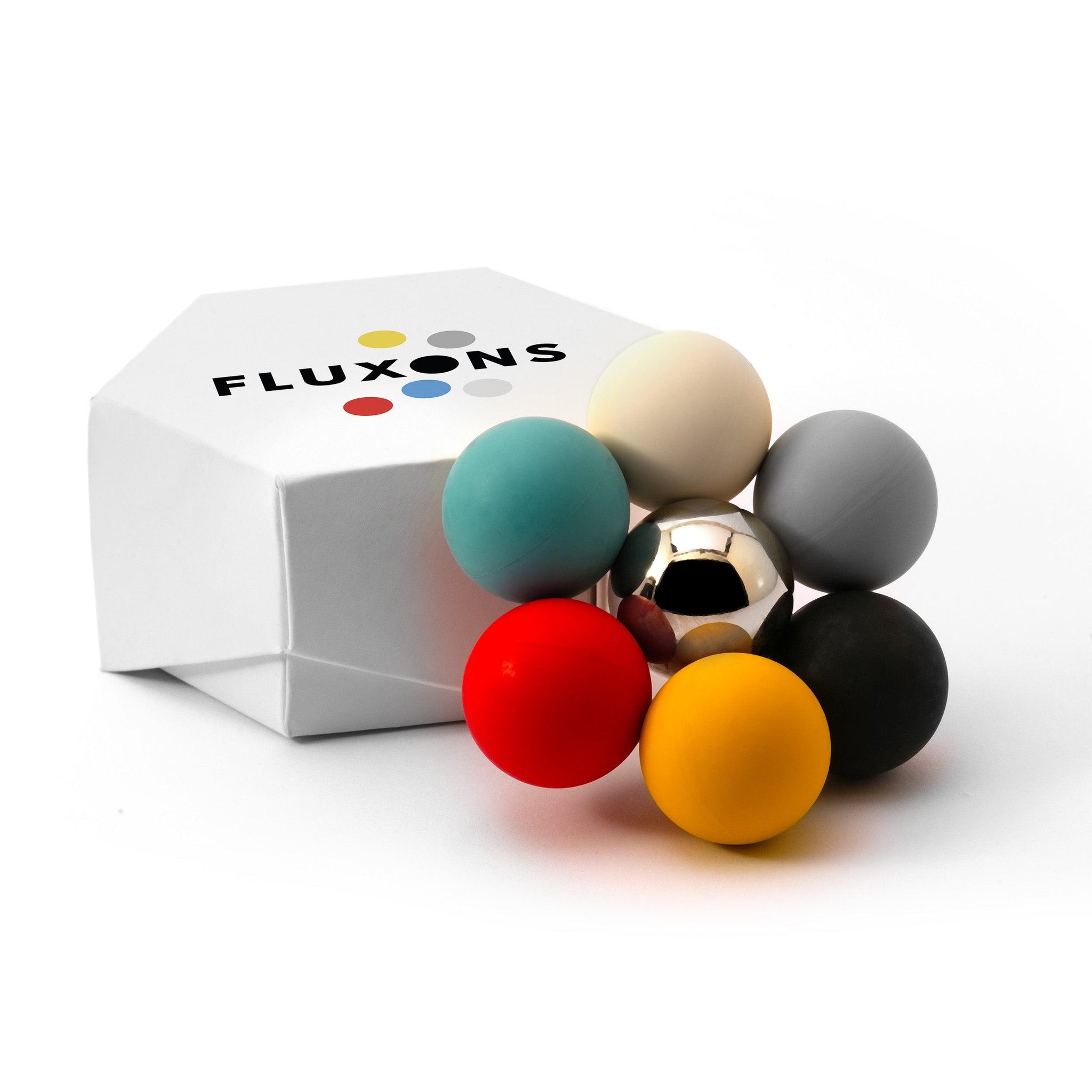 FLUXONS von Feel Flux mit weisser Box und sechs farbigen Kugeln