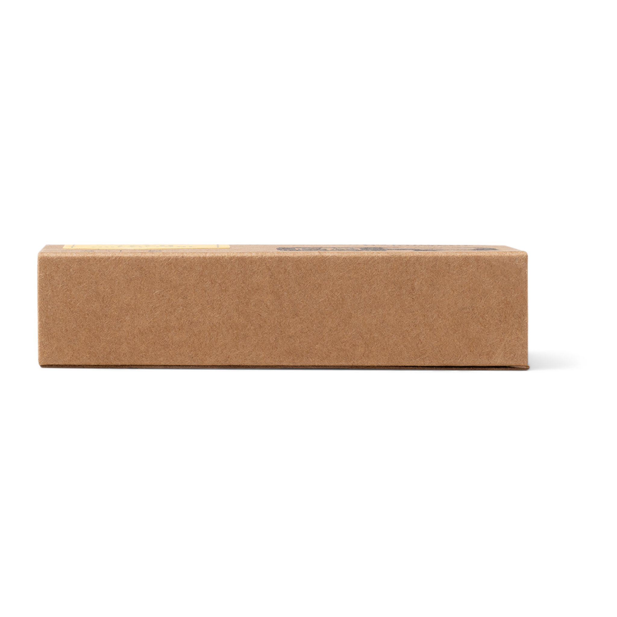 Vue latérale étroite de la boîte en carton brun du Multi-Outil Technique, sans texte lisible sur cette face
