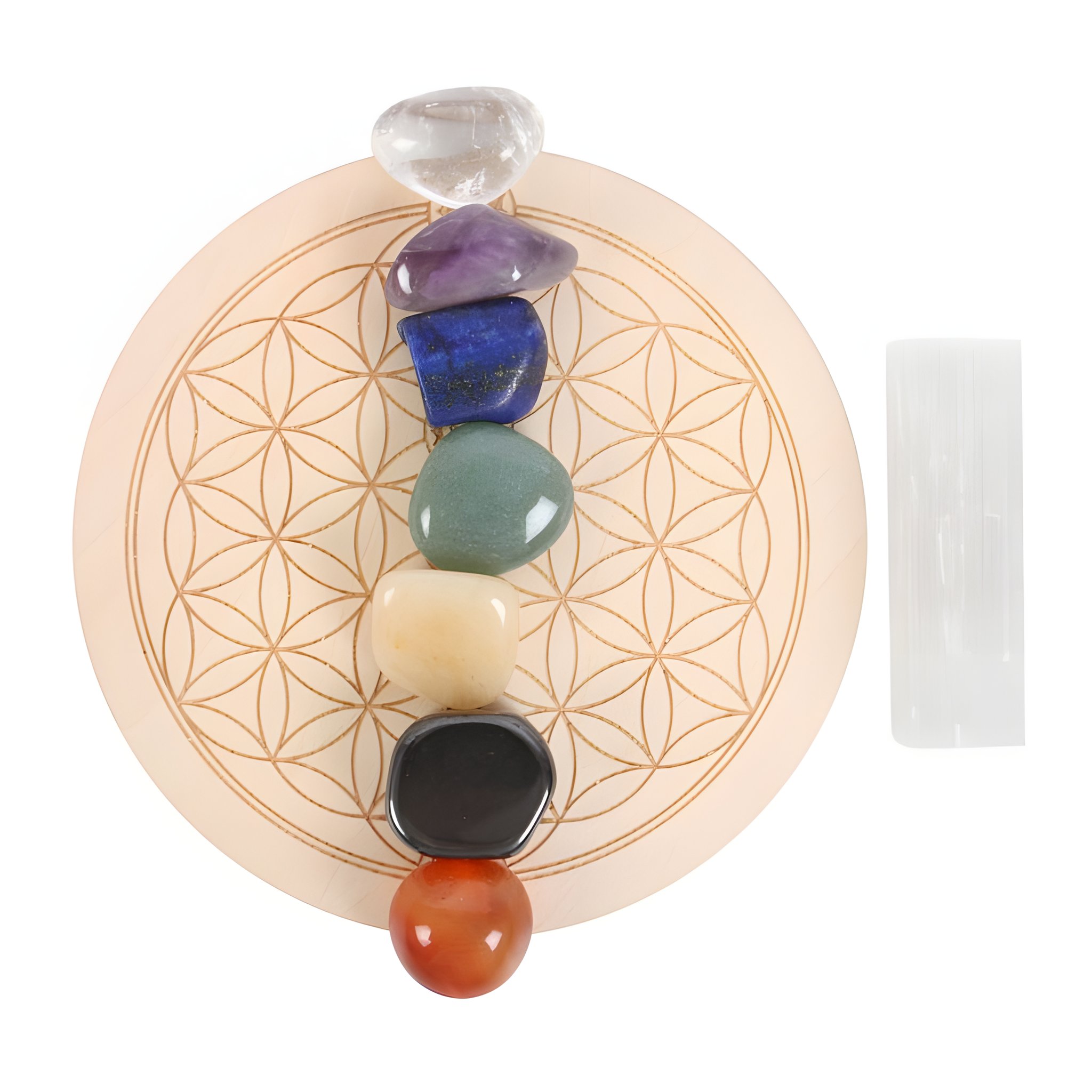 Seven chakra stones arranged on flower of life crystal grid with selenite wand