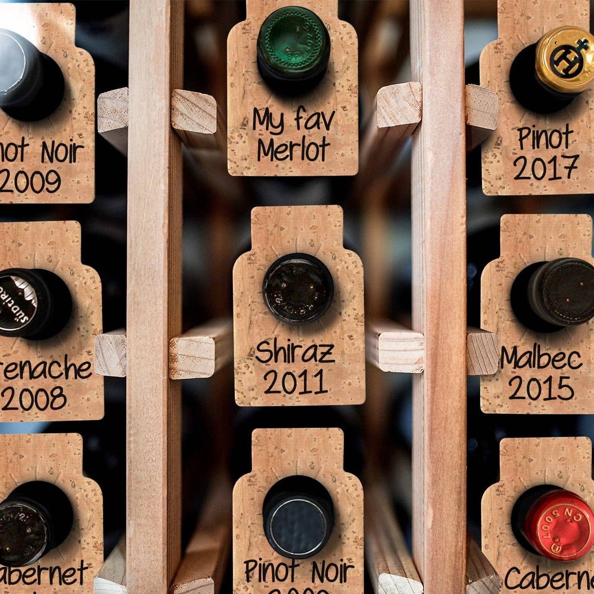 Cork wine tags on bottles in wine rack with labels