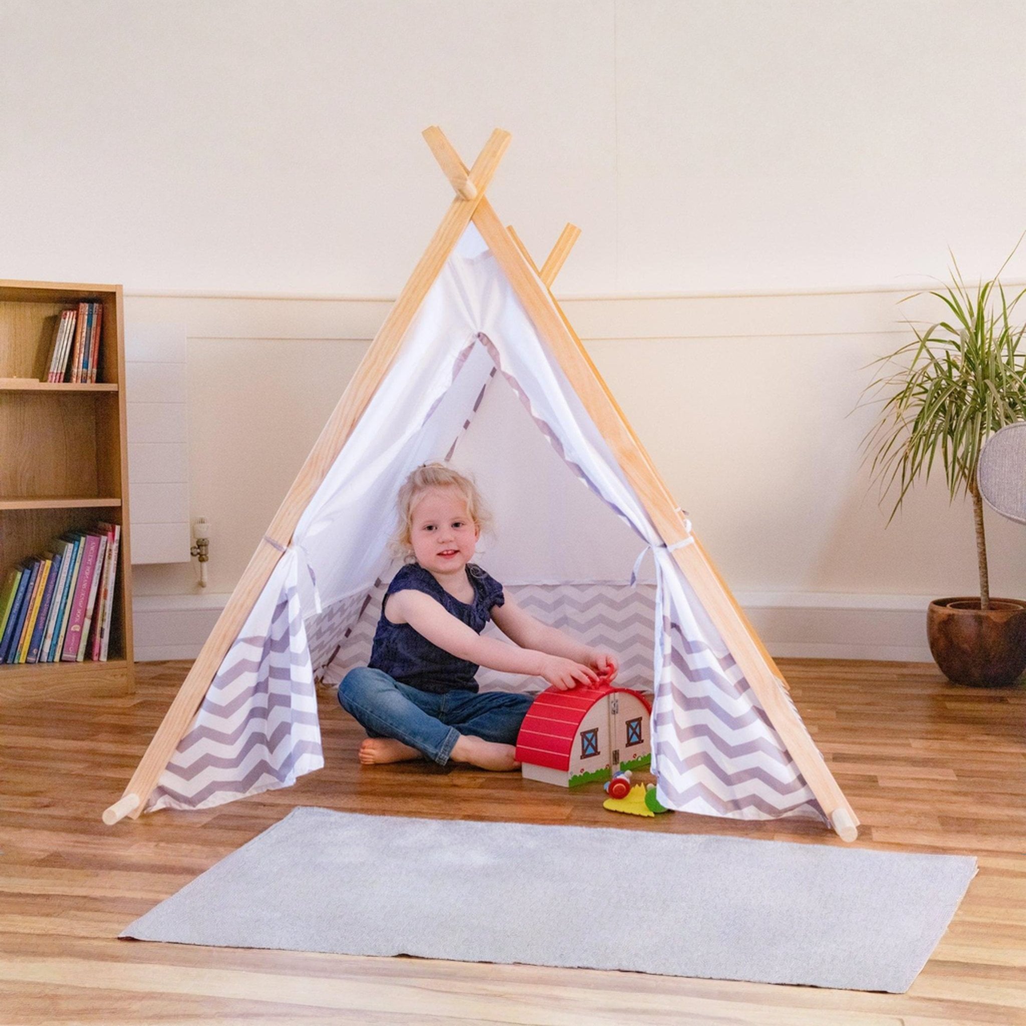 Child playing in the Tobar Canadian play tent