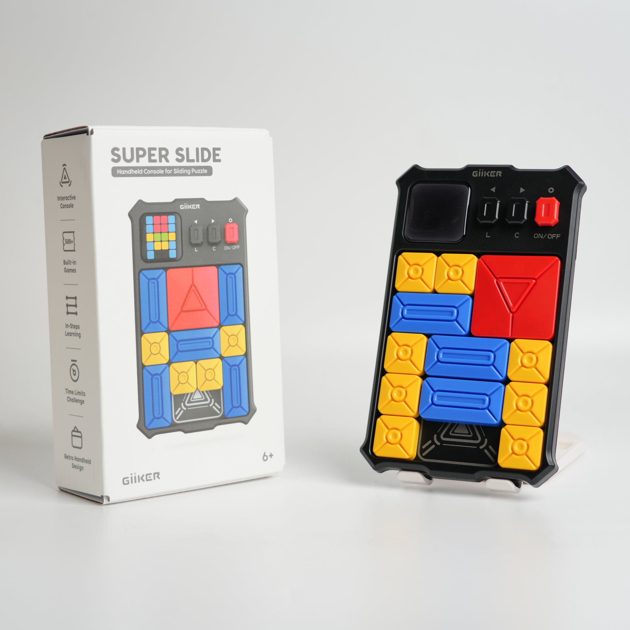 Super Slide sliding puzzle next to its white box, studio shot on a neutral background.