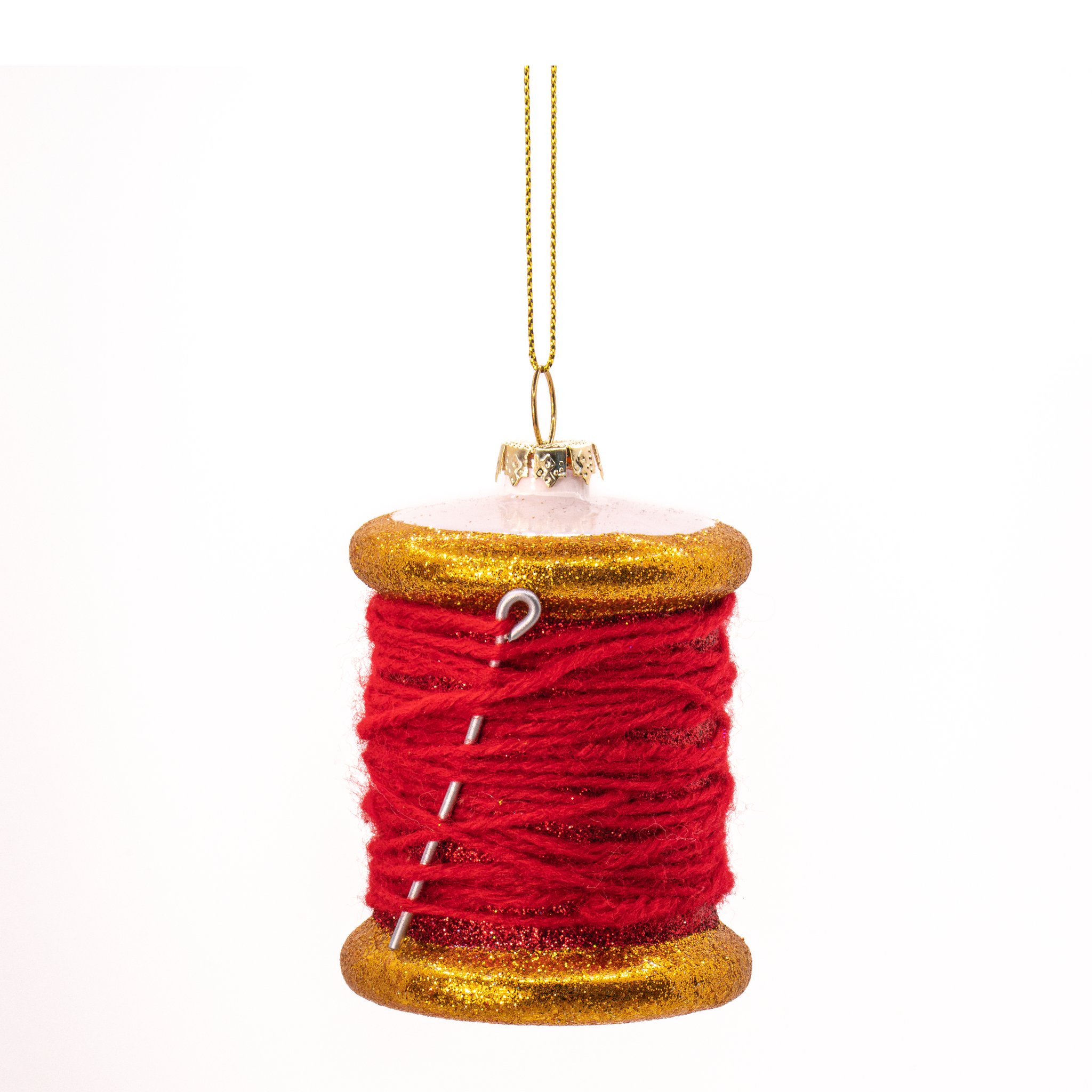 Rote Garnspule aus Glas mit Nähnadel und goldenen Rändern