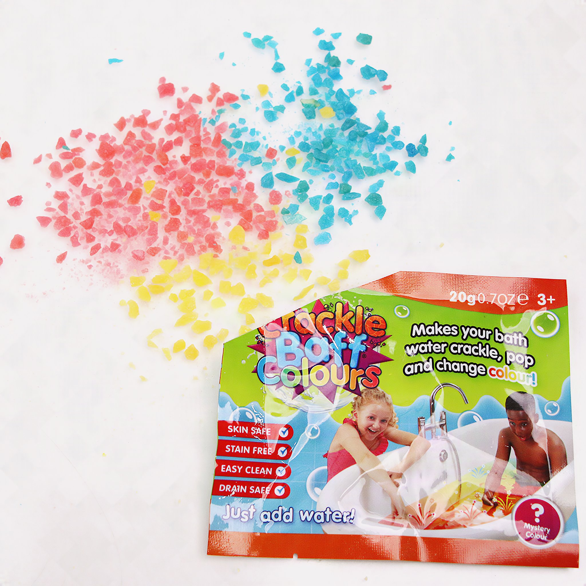 Red, yellow and blue crackling crystals next to a Crackle Baff sachet