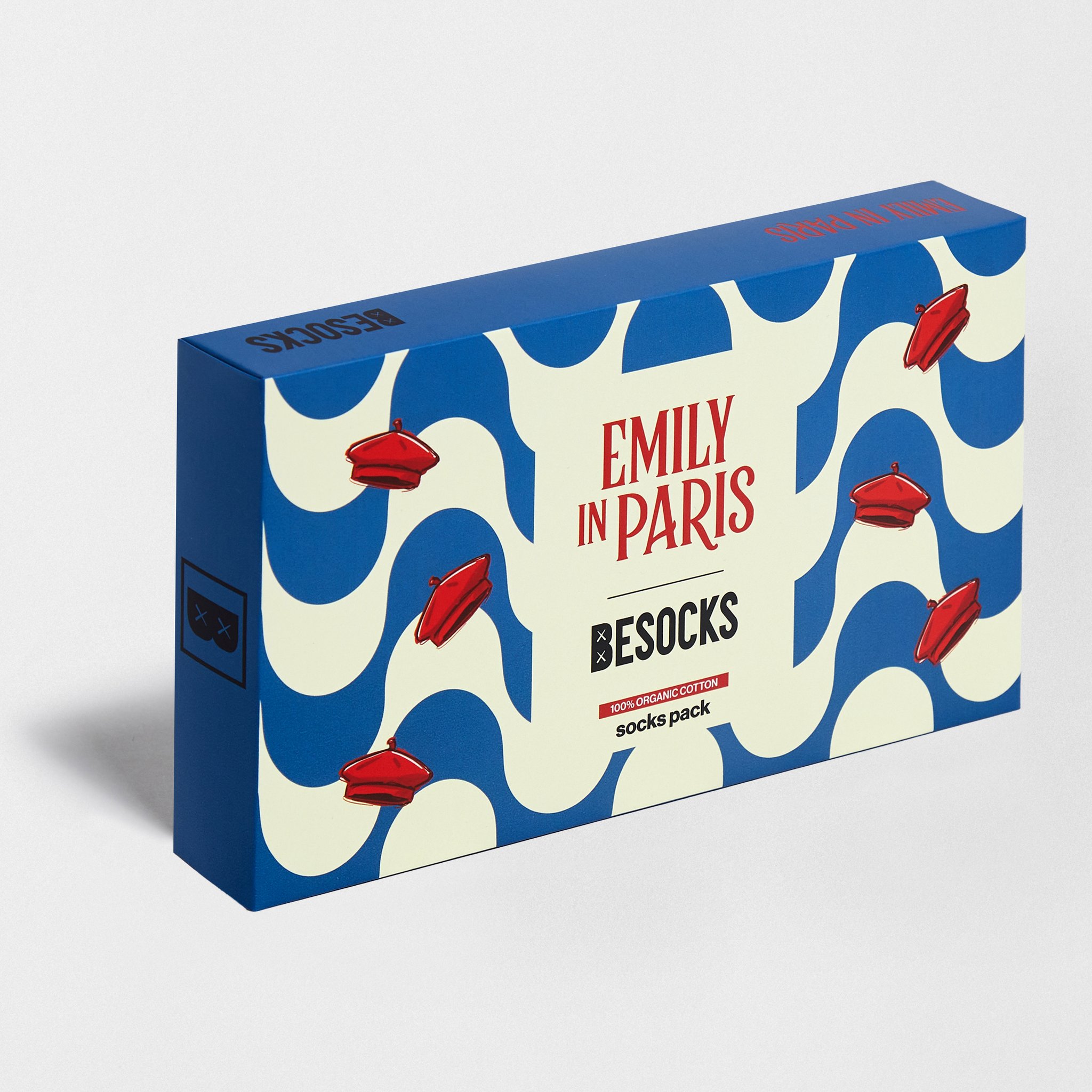 Confezione regalo Emily in Paris chiusa con motivo a onde e baschi rossi