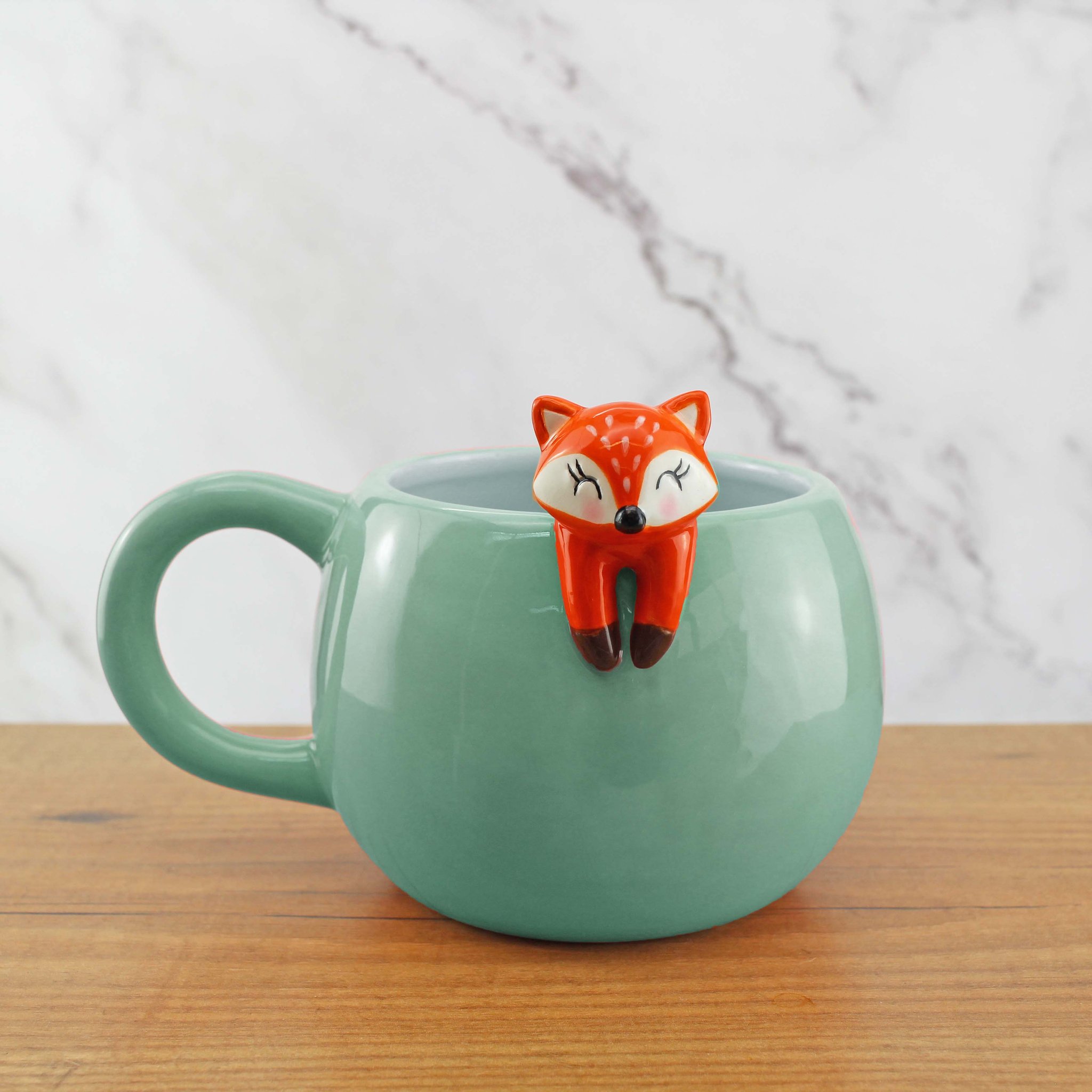Kaffeebecher Fauler Fuchs in Mintgrün mit Fuchsfigur am Rand