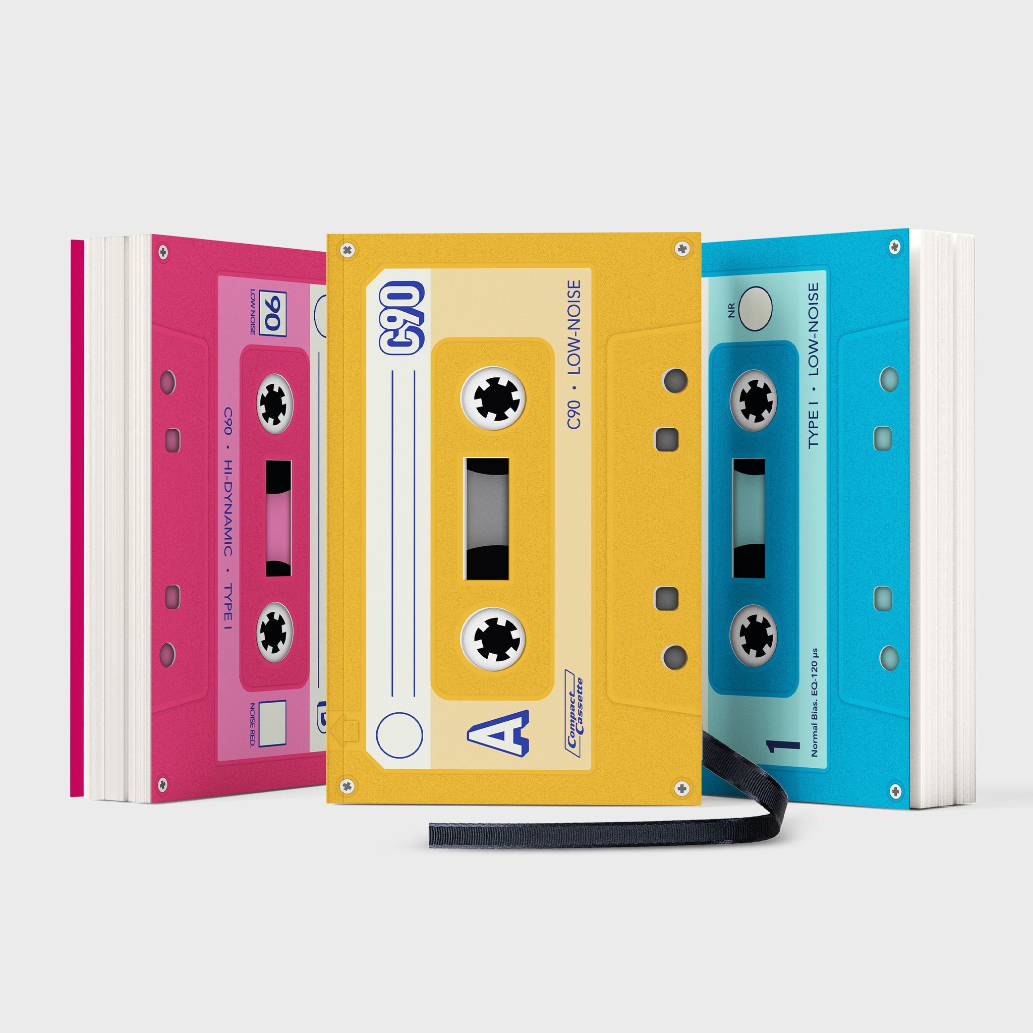Tre quaderni Mixtape rosa, giallo e blu affiancati