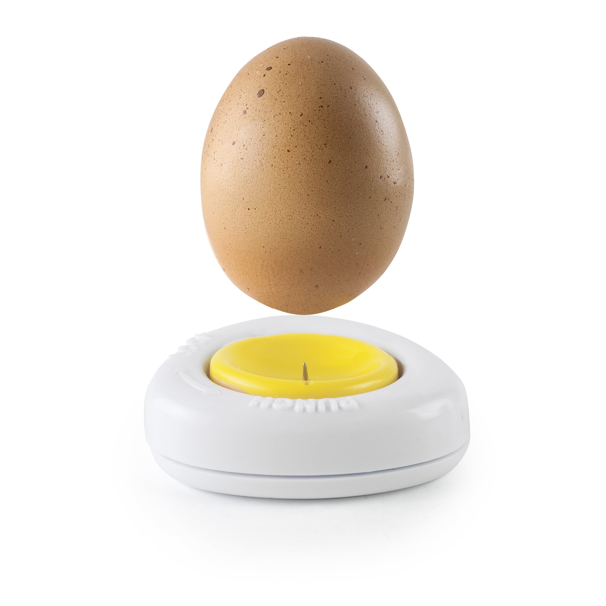 Egg held above the egg piercer just before piercing