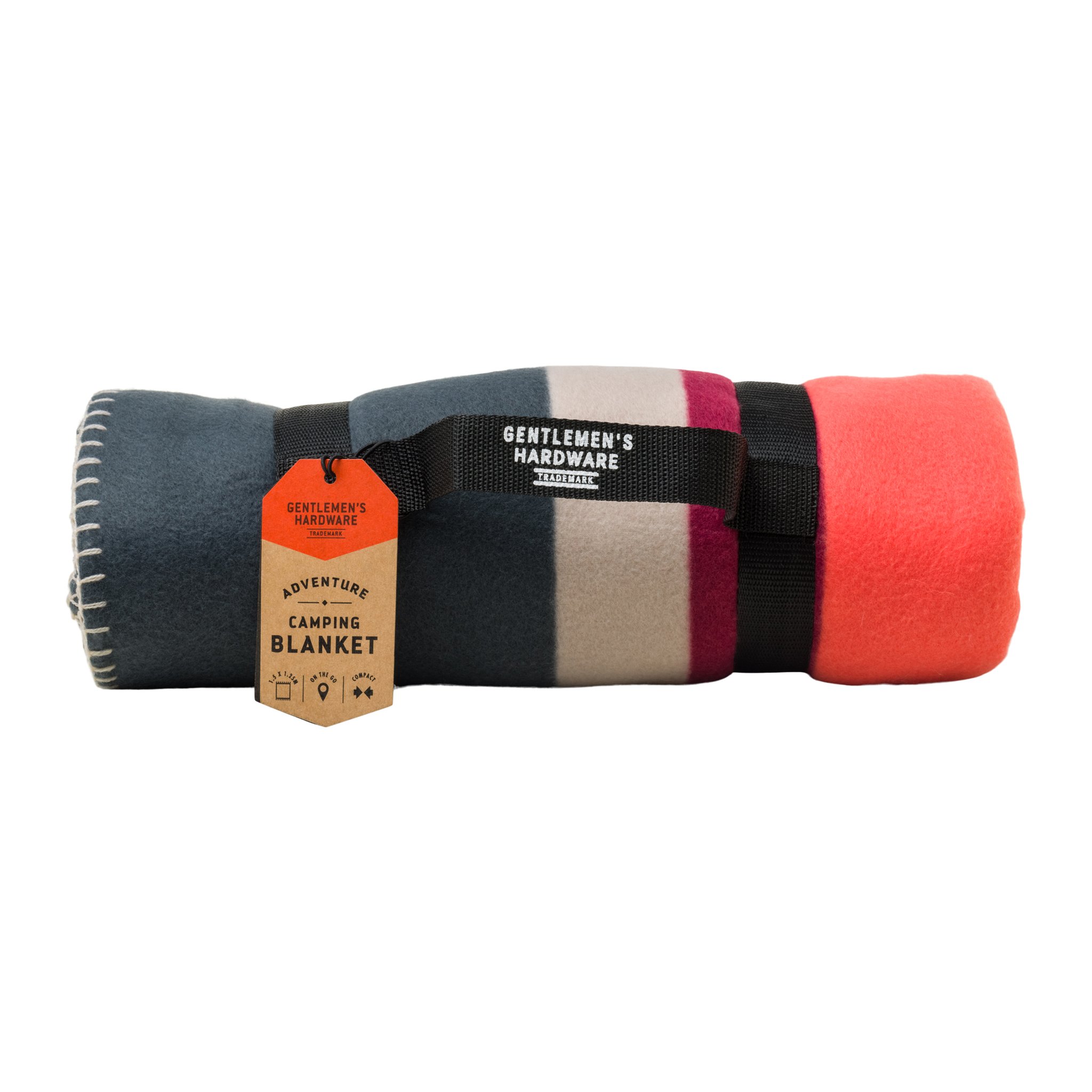 Rolled-up camping blanket in grey, beige, berry and coral with a black carry strap and a brown kraft tag
