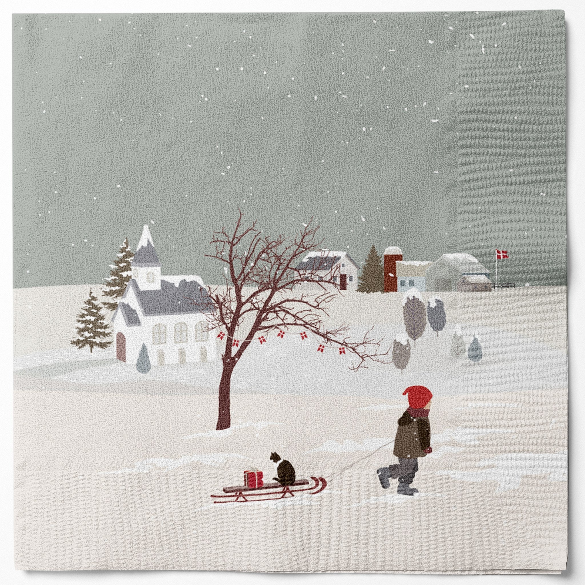 Tovagliolo di carta con chiesa innevata, albero spoglio e persona che tira uno slittino