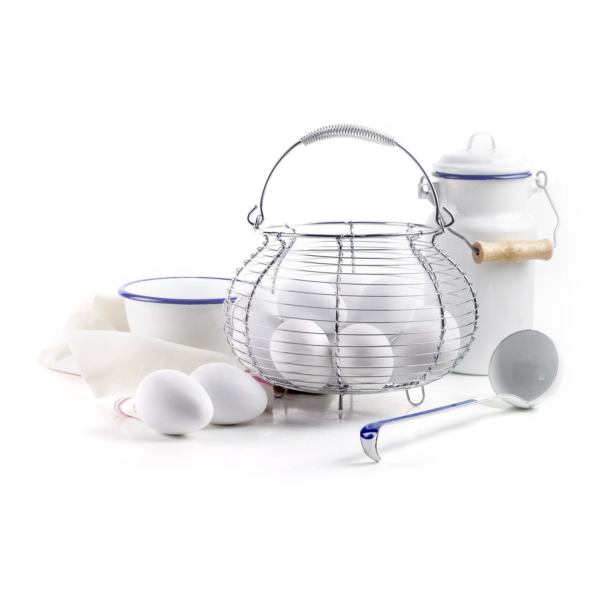 Egg basket with eggs in a kitchen scene with enamel tableware