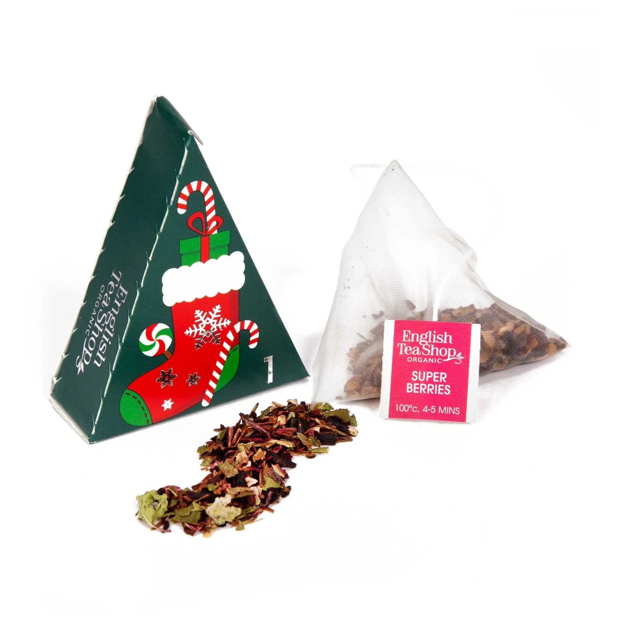 Single triangular tea box from the advent calendar with a pyramid tea bag and loose fruit tea