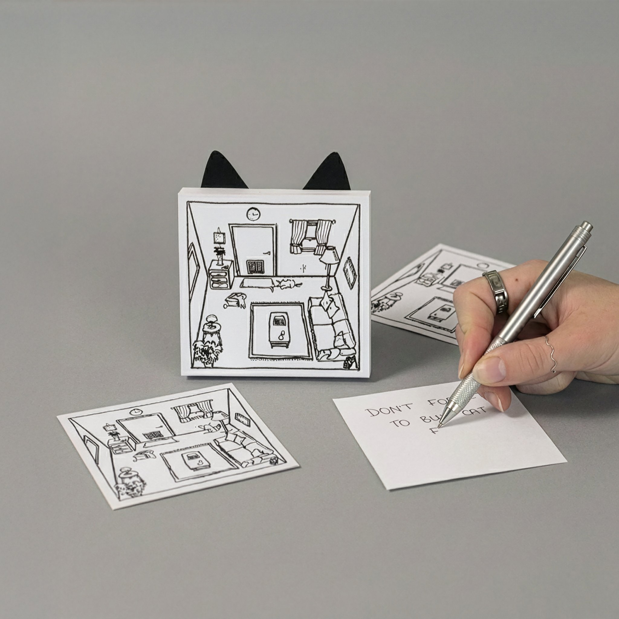 Cat Notes Notizblock – Notiz wird geschrieben