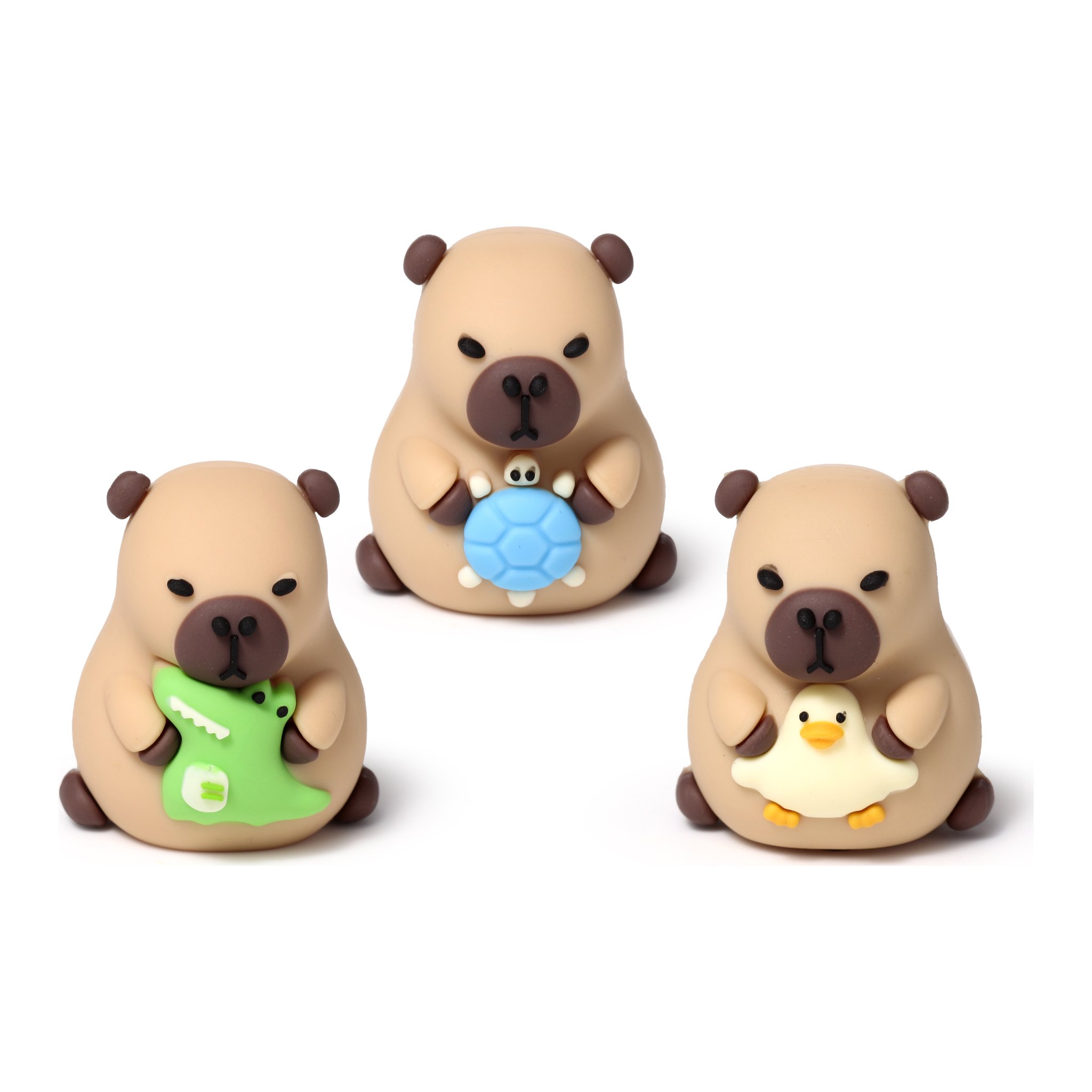 Drei Capybara-Anspitzer mit Krokodil, Schildkroete und Ente