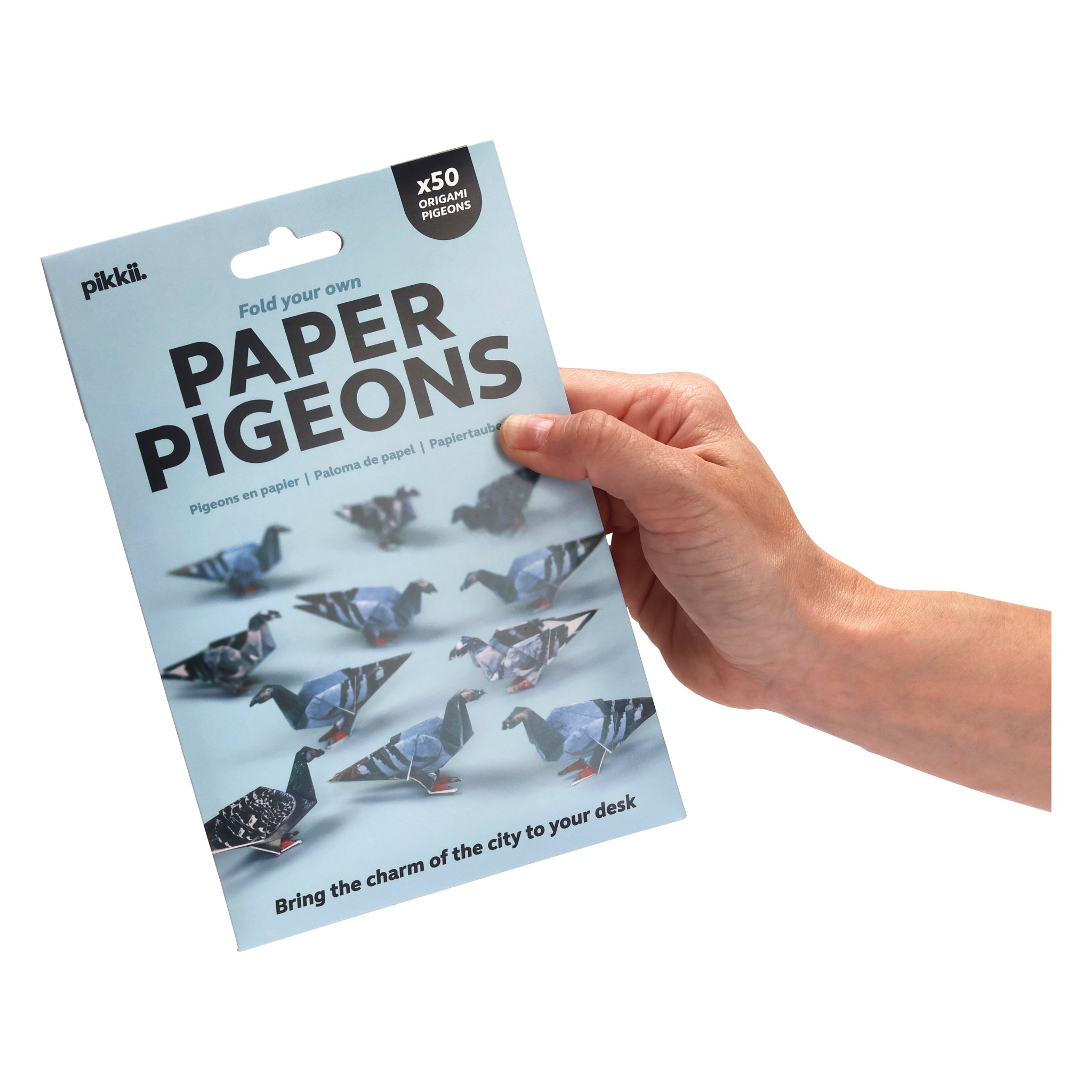 Paper Pigeons origami set – packaging held in hand