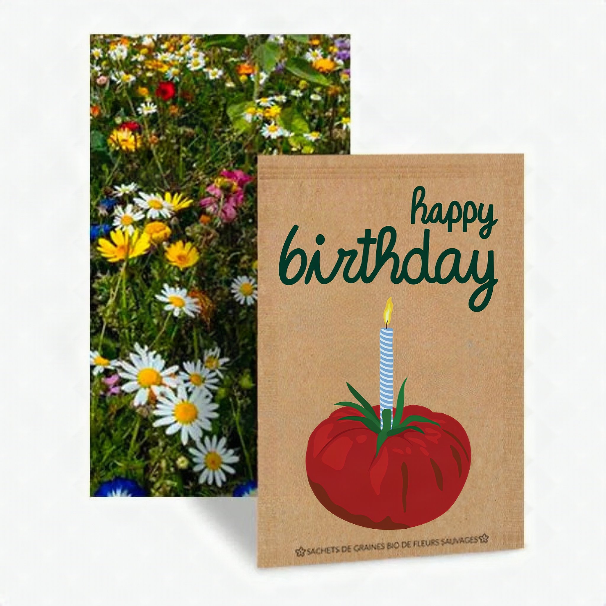 Sachet de graines de fleurs Happy Birthday avec tomate et bougie devant une prairie fleurie